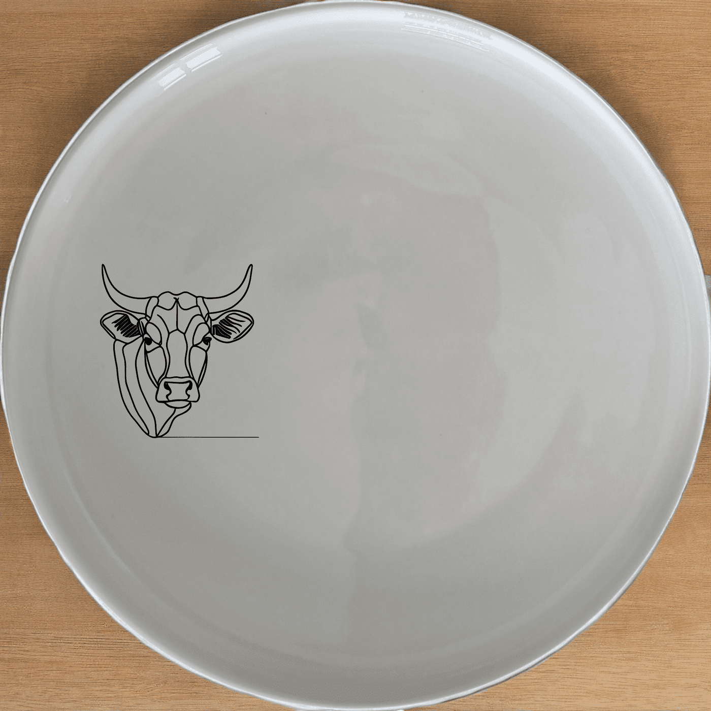 The Nguni Cattle Cow Dinner Plate Set of 4 features a striking silhouette design, perfect for modern dining settings.