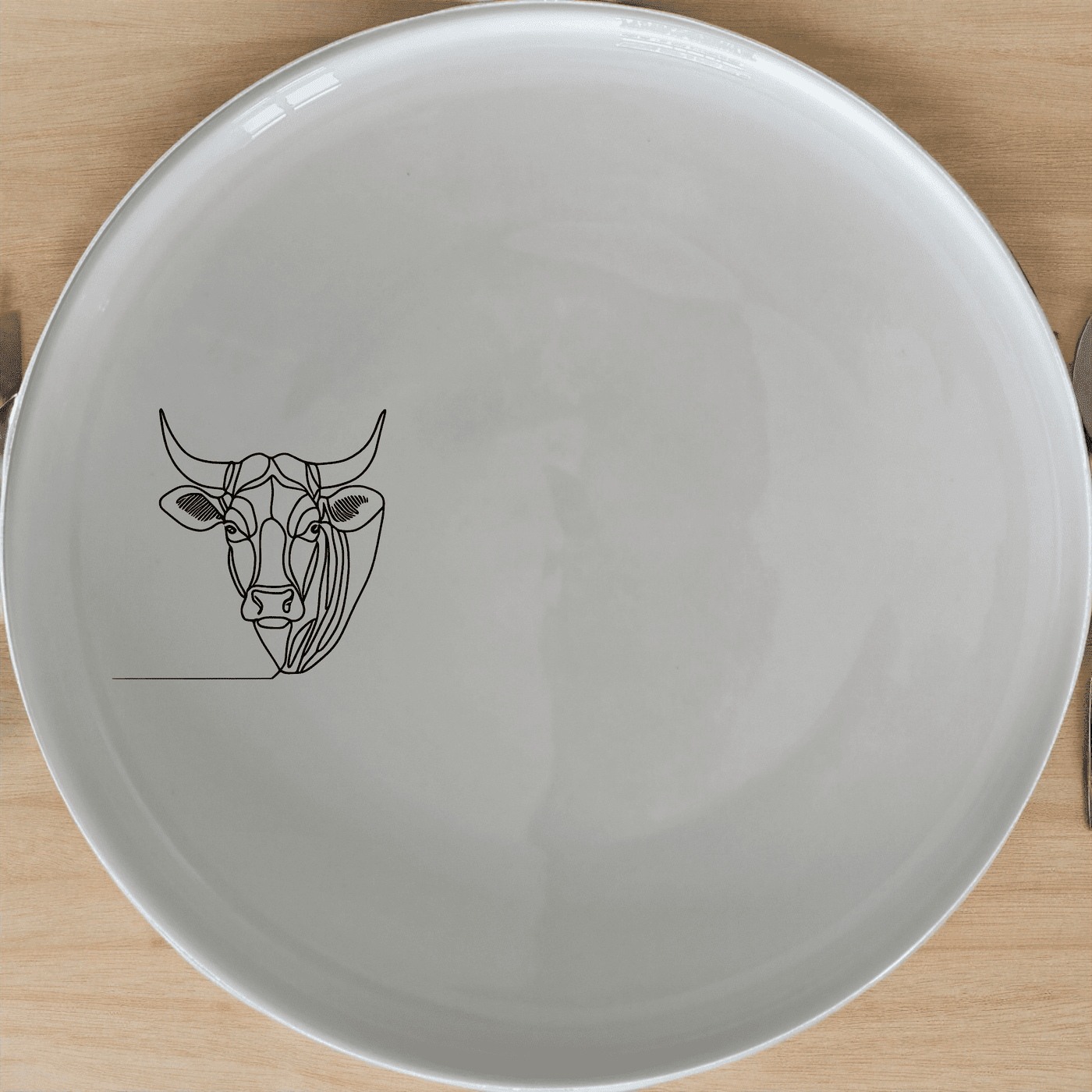 The Nguni Cattle Cow Head Side Plate Set of 4 features a striking silhouette design, perfect for modern dining settings.