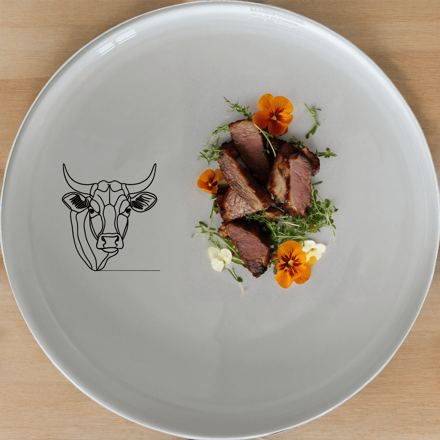 The Nguni Cattle Cow Head Side Plate Set of 4 features a striking silhouette of a Nguni cow head, perfect for adding a touch of African artistry to your dining table.