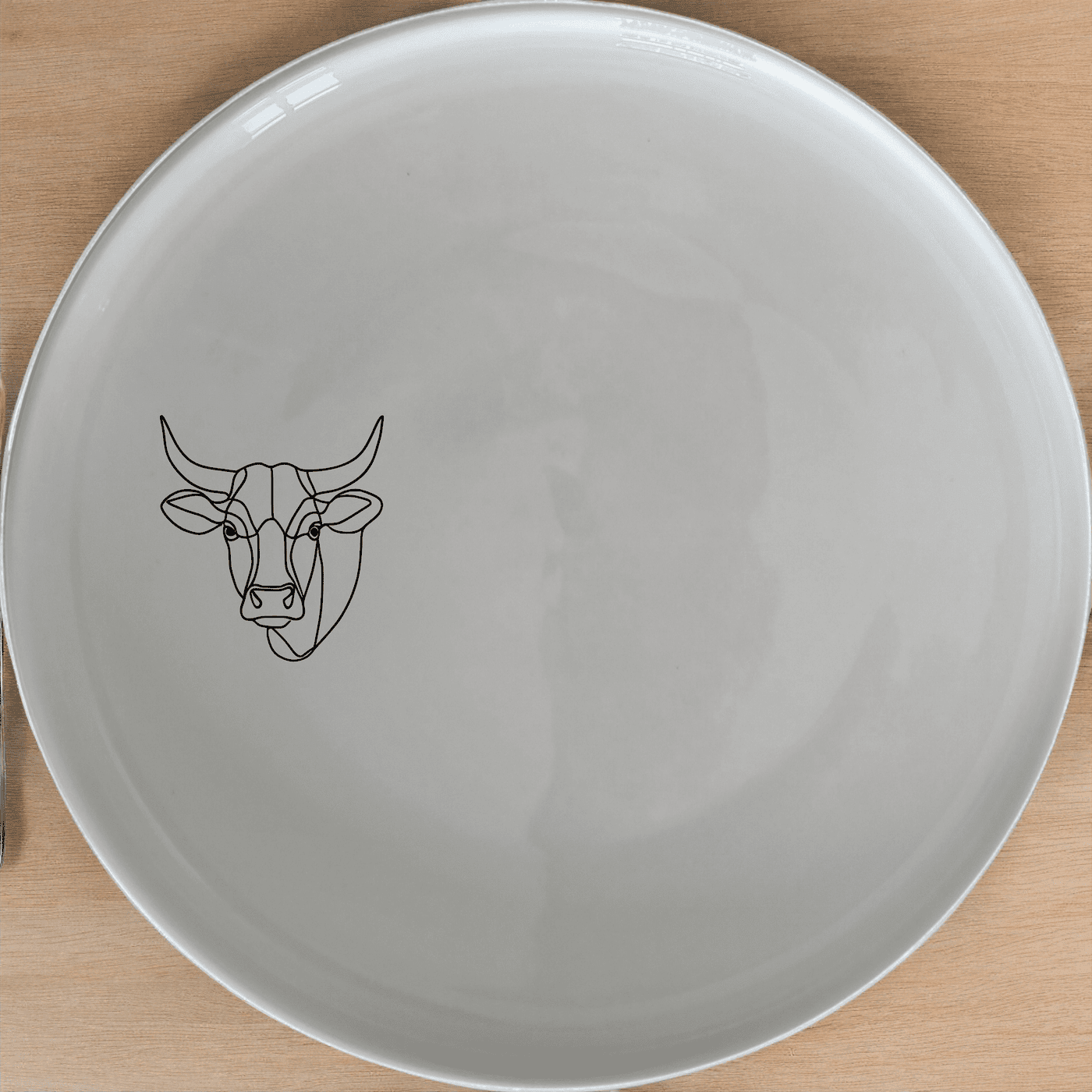 The Nguni Cattle Cow Head Side Plate Set of 4 features a striking silhouette design, perfect for modern and rustic home decors.