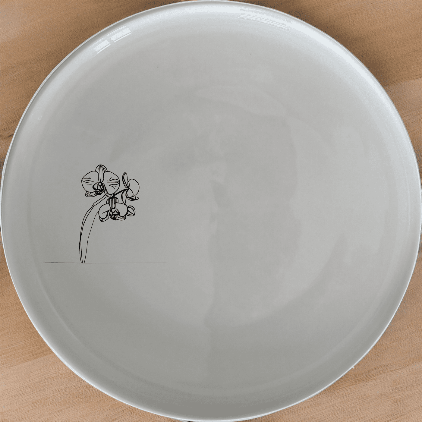 The Orchid Stems Dinner Plate Set of 4 features delicate laser-etched designs for an elegant dining experience.