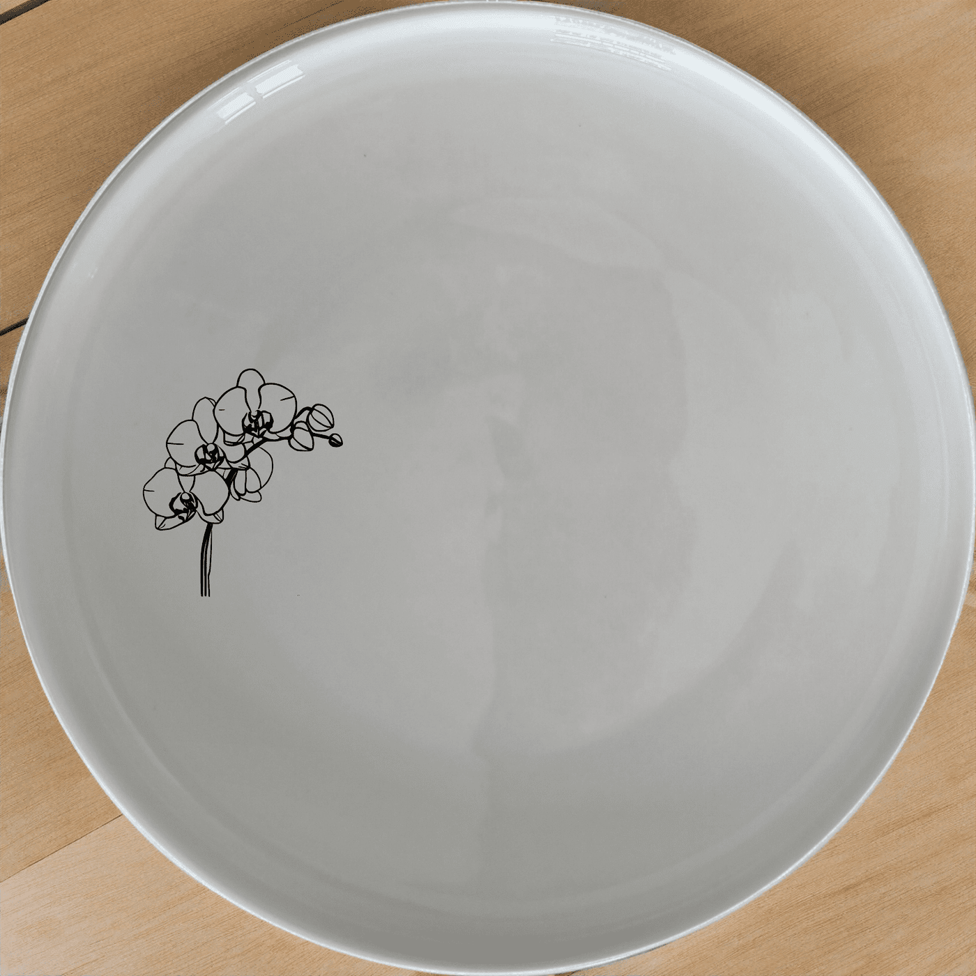 Orchid Stems Dinner Plate Set of 4 features delicate laser-etched designs on white ceramic plates, perfect for modern dining.