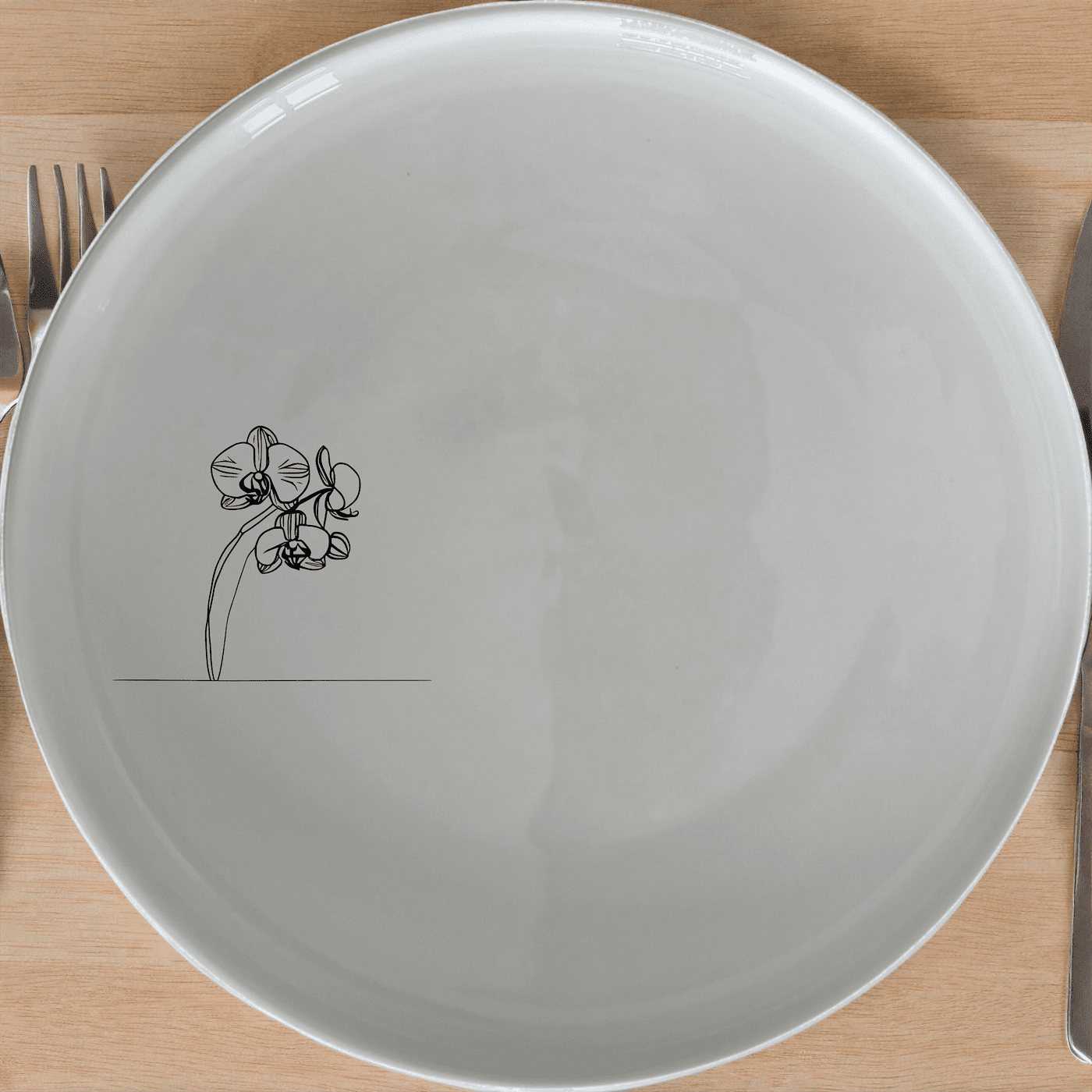 The Orchid Stems Side Plate Set of 4 features a delicate laser-etched orchid design, perfect for adding a touch of nature to your dining experience.