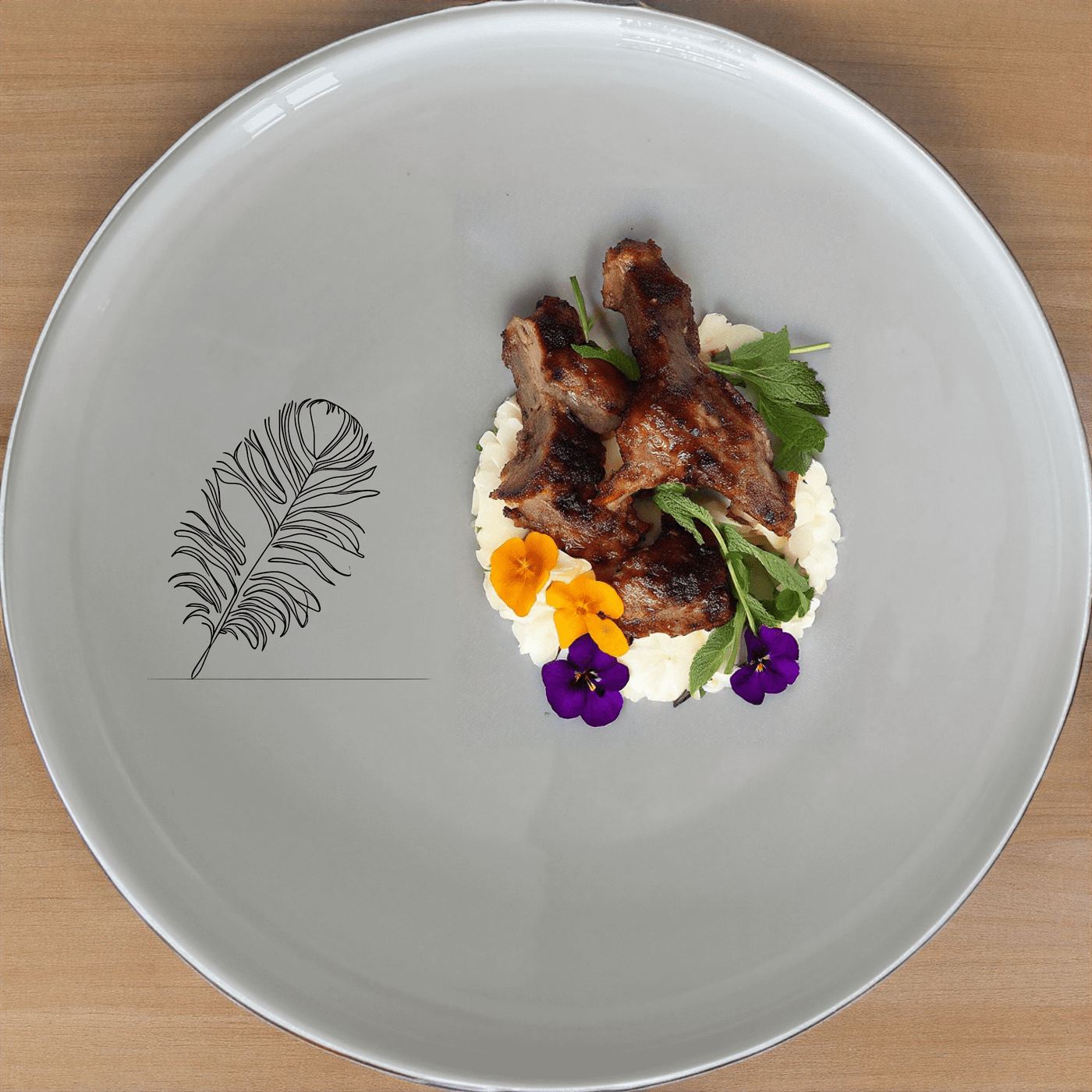The Ostrich Feather Dinner Plate Set of 4 adds a touch of nature to your dining table with its delicate, detailed design.