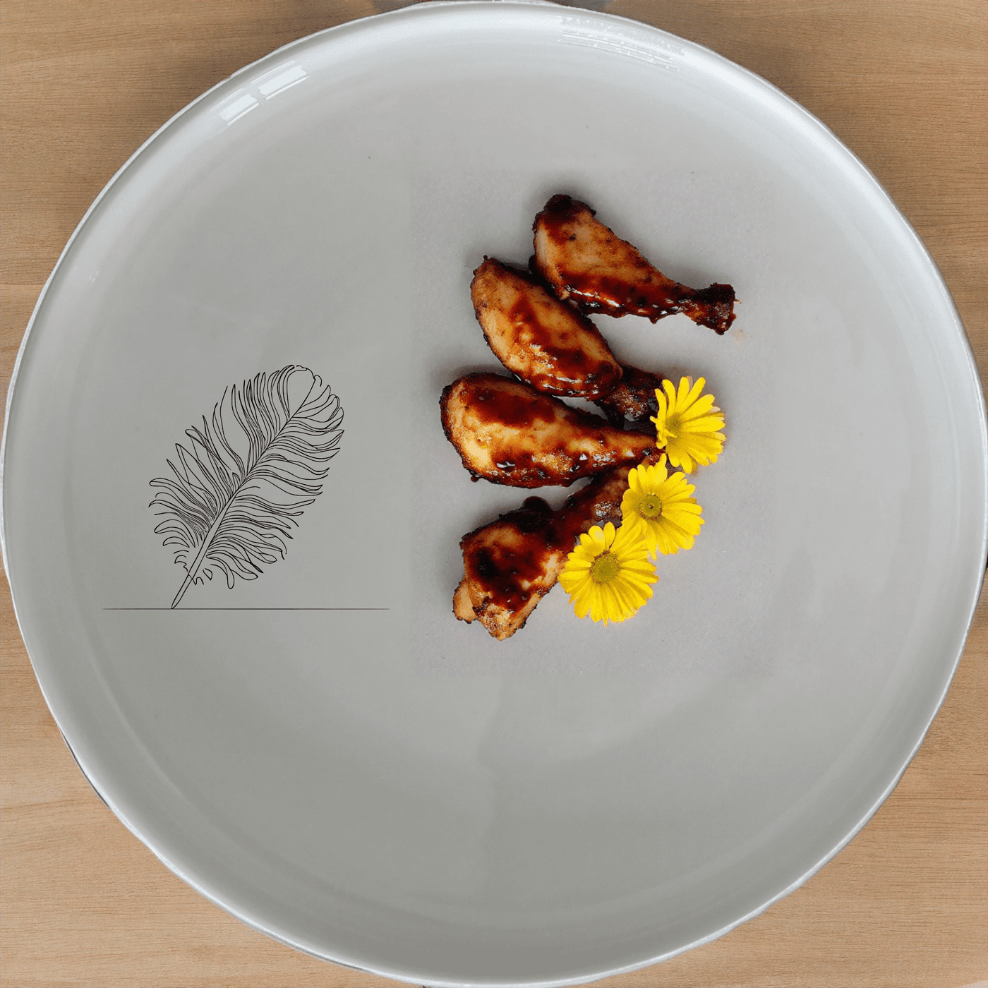 The Ostrich Feather Side Plate Set of 4 adds a touch of elegance to any dining table with its delicate laser-etched design.