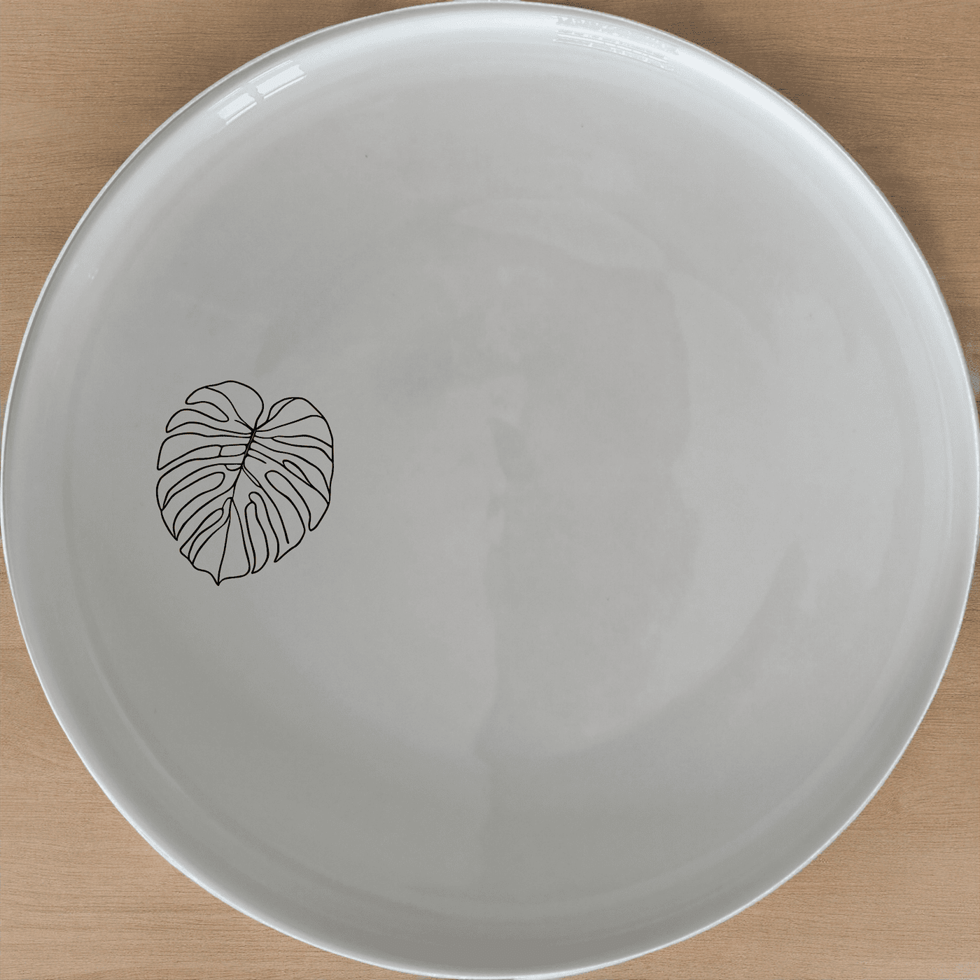 The Oversized Monstera Leaves Dinner Plate Set of 4 adds a touch of nature to your dining table with its elegant botanical design.