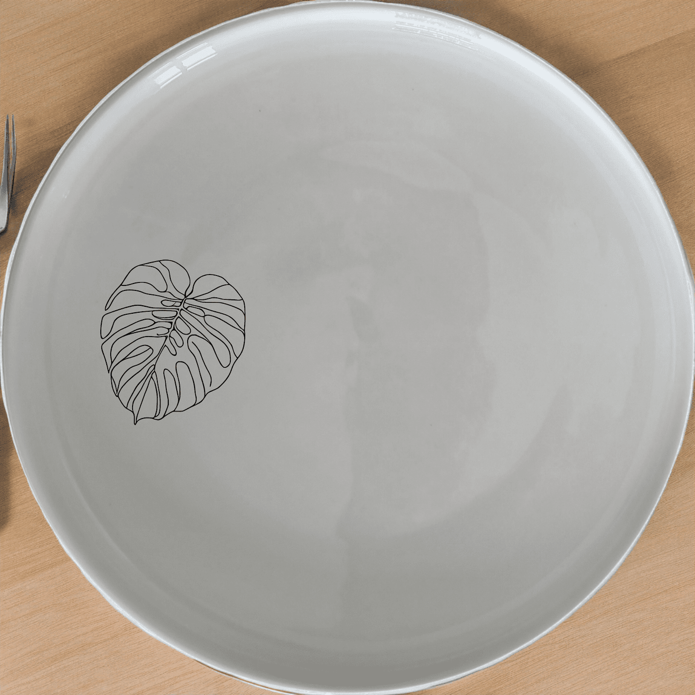 Elevate your dining experience with the Oversized Monstera Leaves Side Plate Set of 4, featuring a bold botanical design.