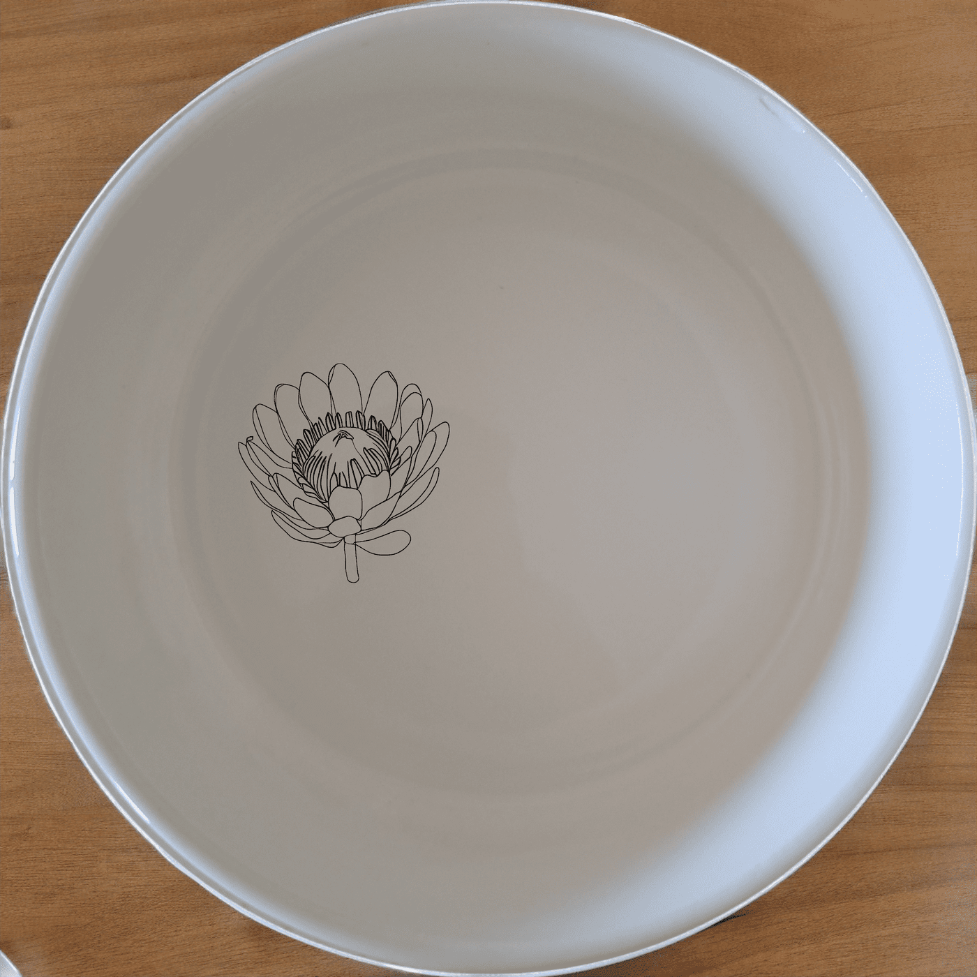 The Pincushion Protea Flower Bowl Set of 4 features delicate botanical designs, perfect for everyday use or special occasions.