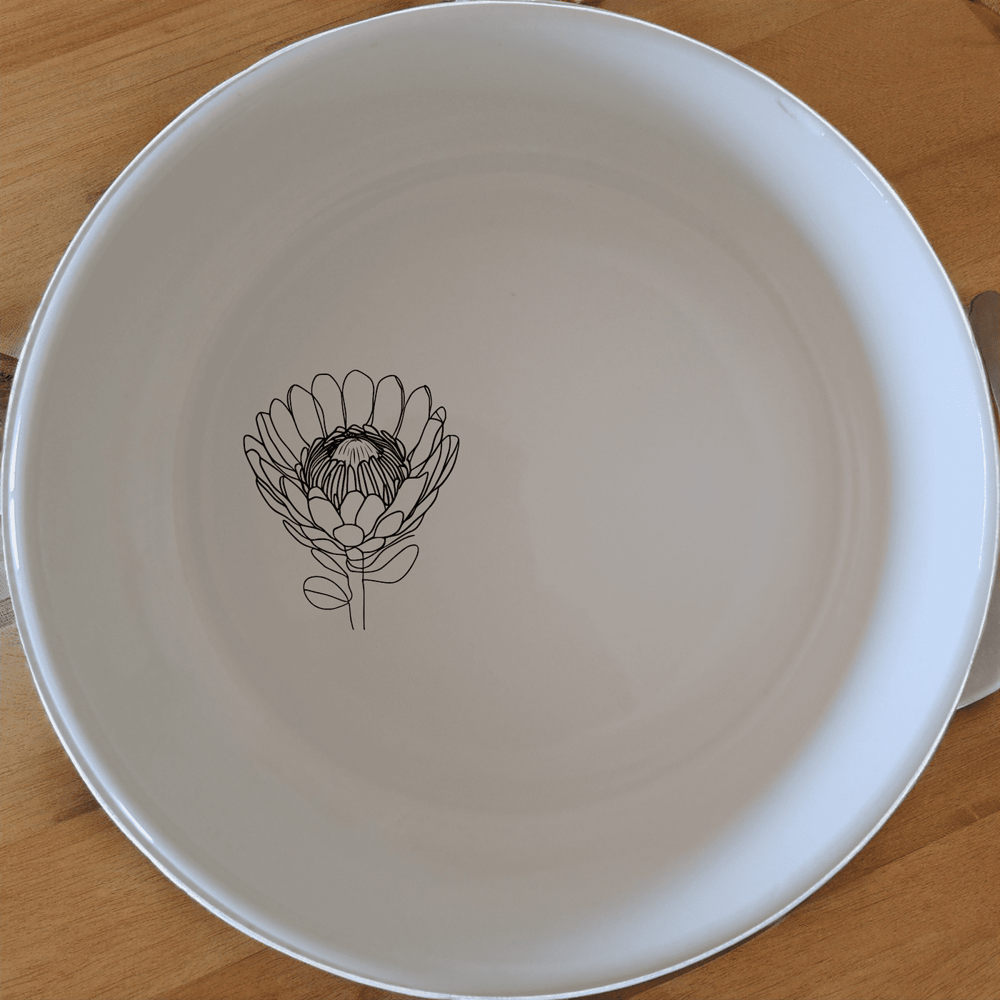 The Pincushion Protea Flower Bowl Set of 4 features delicate botanical designs perfect for everyday use or special occasions.