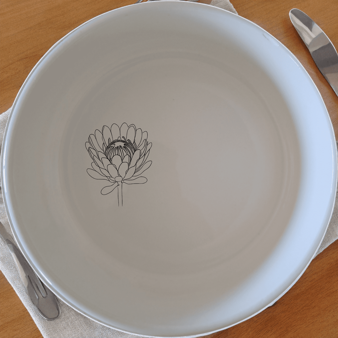 The Pincushion Protea Flower Bowl Set of 4 adds a touch of nature to your dining table with its elegant design.