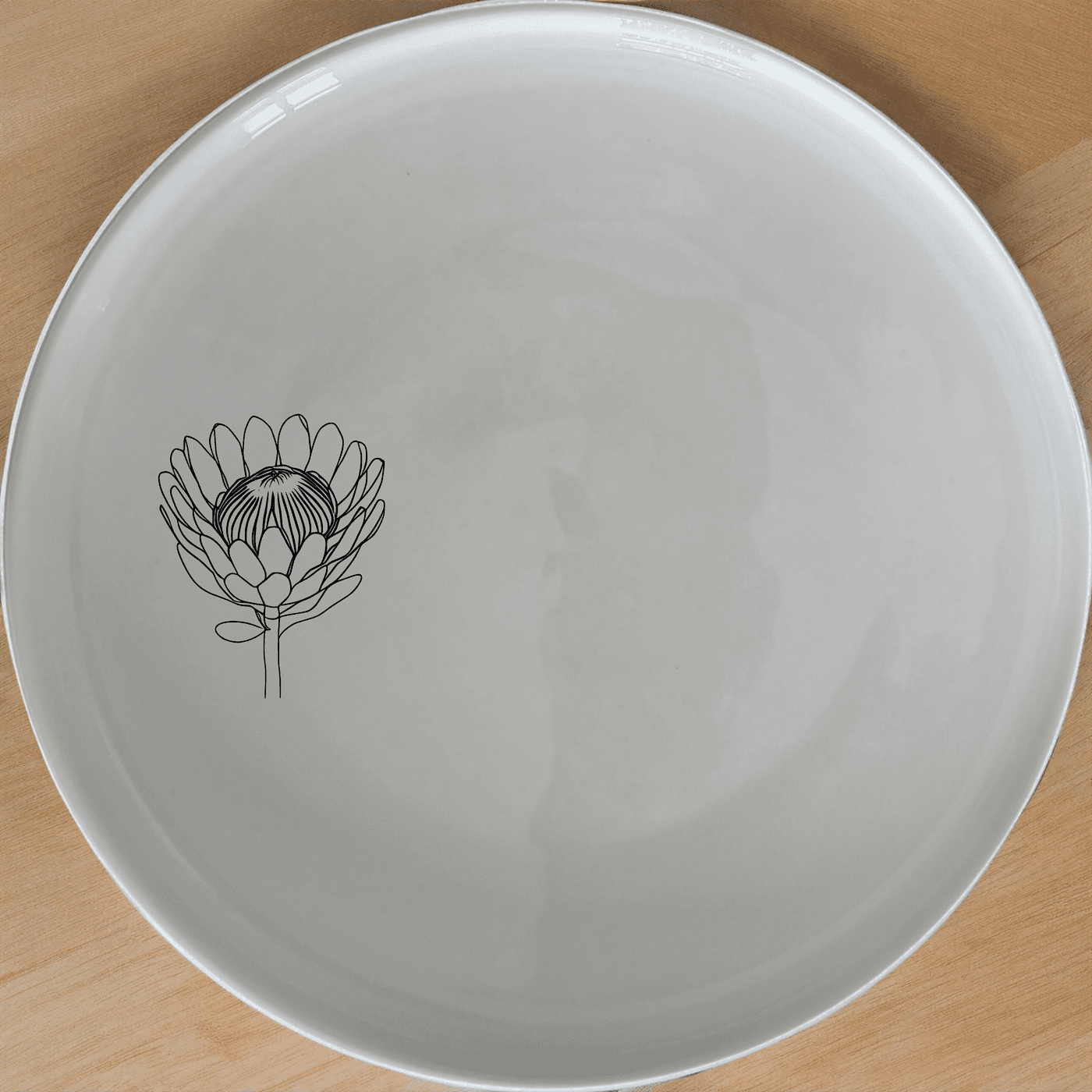 The Pincushion Protea Flower Dinner Plate Set of 4 features elegant botanical designs perfect for any dining occasion.