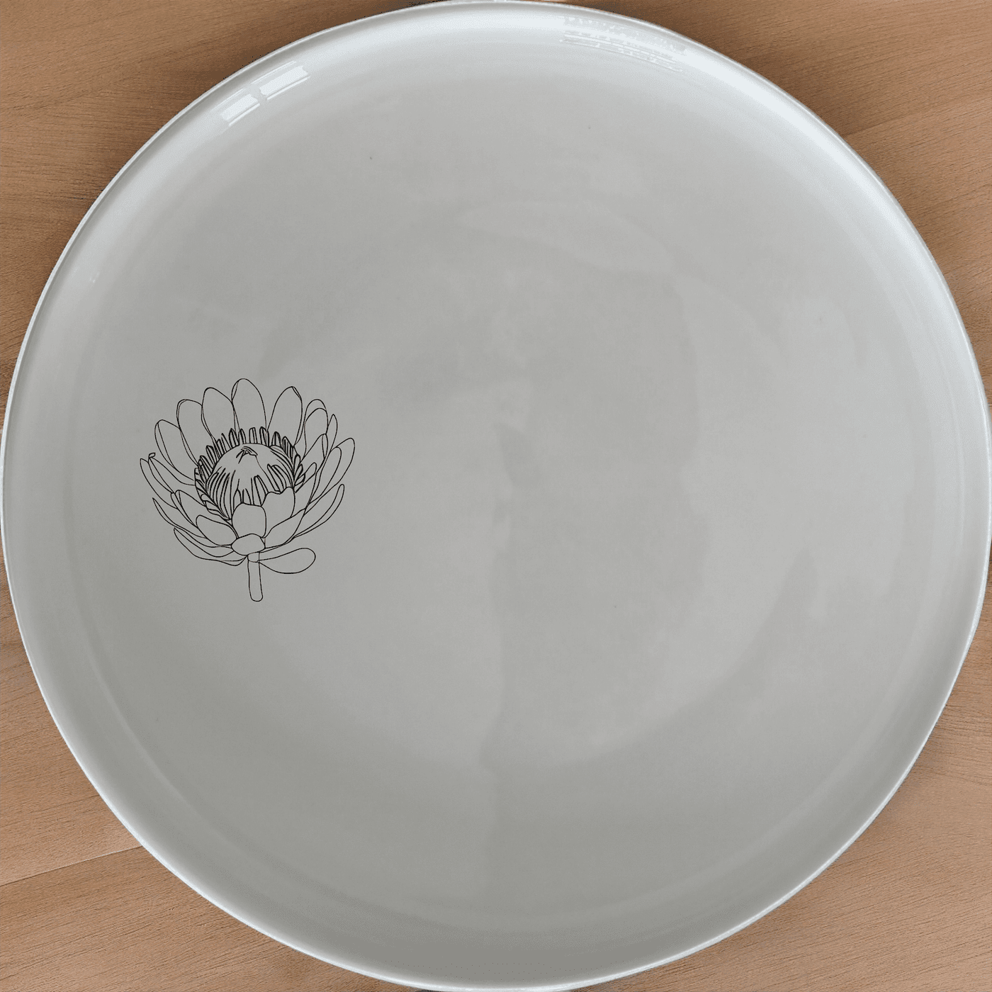 The Pincushion Protea Flower Dinner Plate Set of 4 features a delicate botanical design, perfect for elevating everyday meals with a touch of nature.