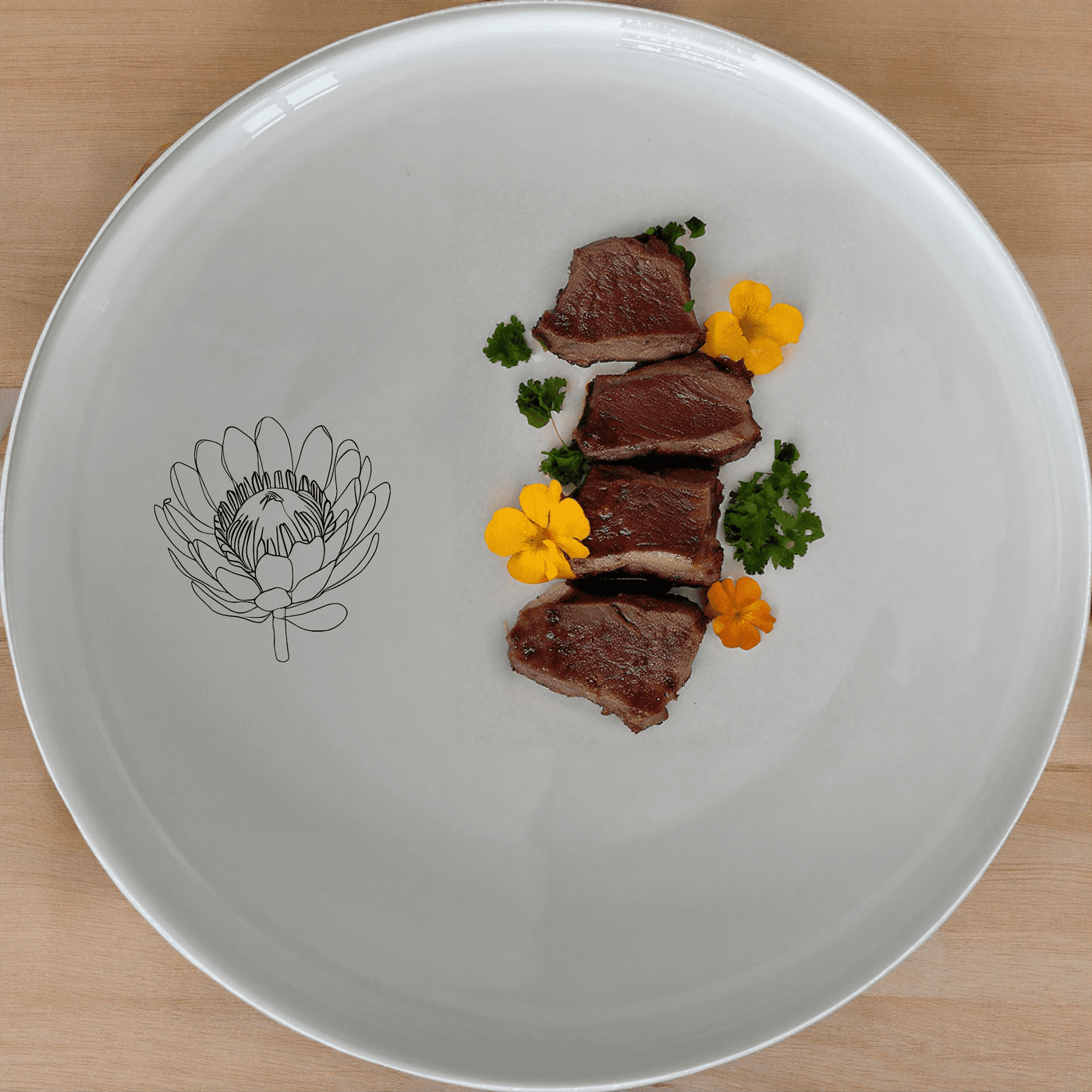 The Pincushion Protea Flower Side Plate Set of 4 features a delicate laser-etched design, perfect for everyday use or special occasions.