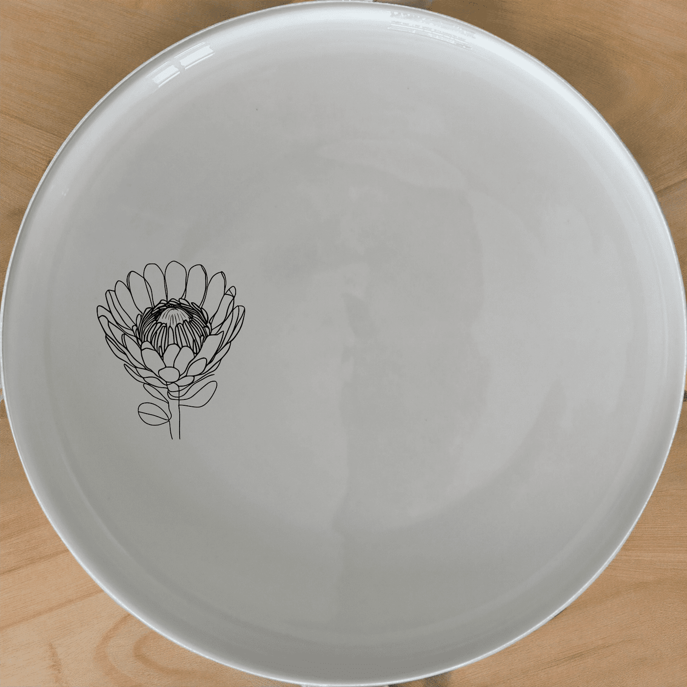 The Pincushion Protea Flower Side Plate Set of 4 adds a touch of nature to your dining table with its elegant floral design.