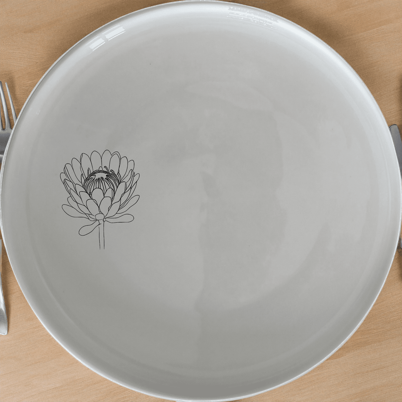 The Pincushion Protea Flower Side Plate Set of 4 features elegant botanical designs perfect for any dining table.