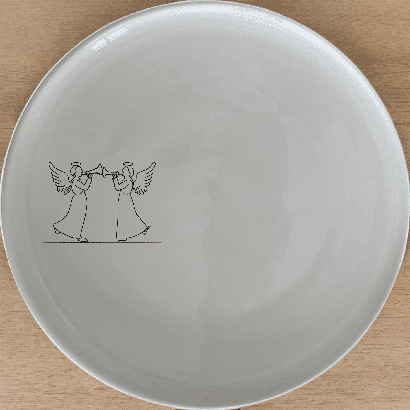 Angels Trumpet Dinner Plate Set of 4 - Range 4 is a beautiful and elegant set of dinner plates featuring a delicate silhouette of two angels playing trumpets. Perfect for special occasions or everyday use.