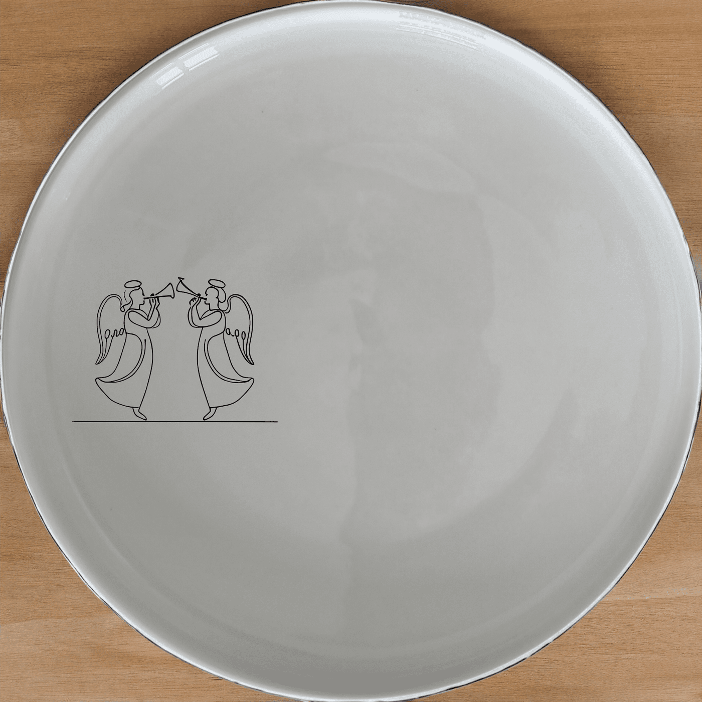 Angels Trumpet Side Plate Set of 4 - Range 4 is a stunning set of four elegant white ceramic plates featuring a delicate laser-etched design of two angels with trumpets. Perfect for adding a touch of sophistication to any dining table.