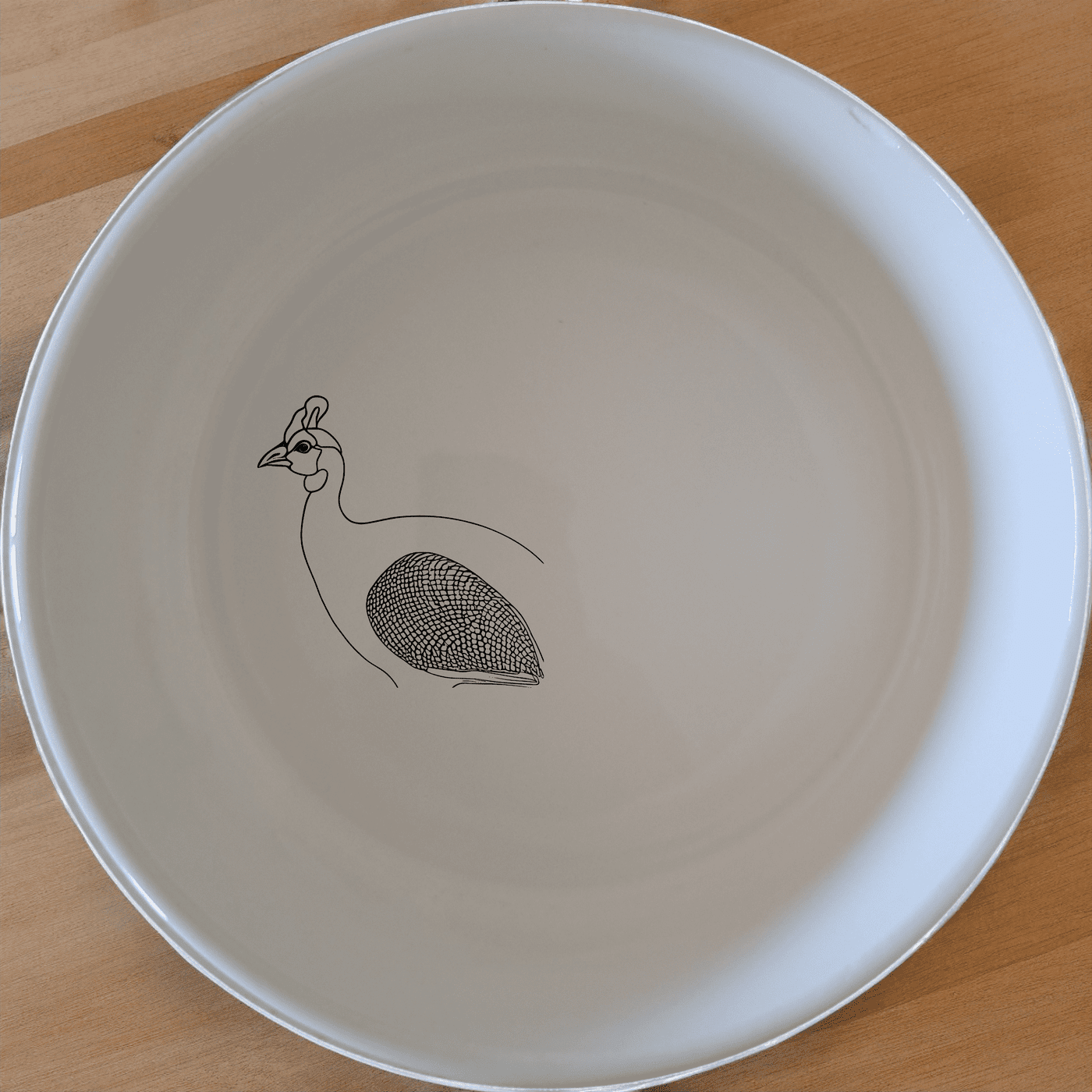 The South African Helmeted Guineafowl Bowl Set of 4 features elegant ceramic bowls with a distinctive bird design, perfect for any dining occasion.