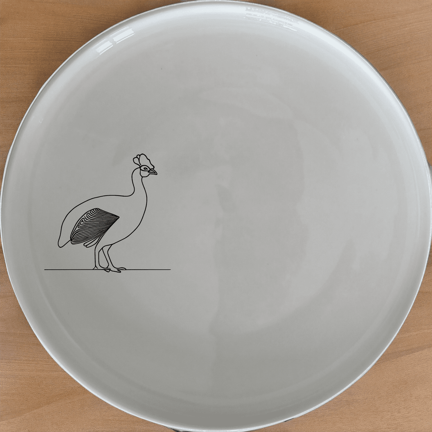 The South African Helmeted Guineafowl Dinner Plate Set of 4 features a striking silhouette design, perfect for adding a touch of nature to your dining experience.