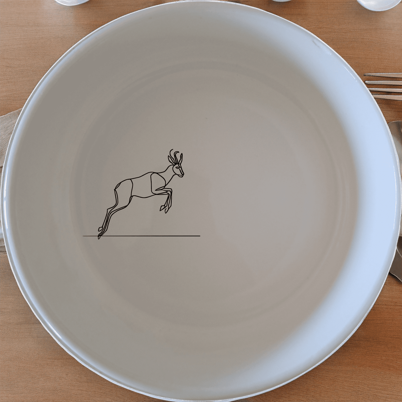 The Springbok Leaping Graceful Silhouette Bowl Set of 4 features a leaping springbok antelope silhouette design, perfect for adding a touch of nature to your dining experience.