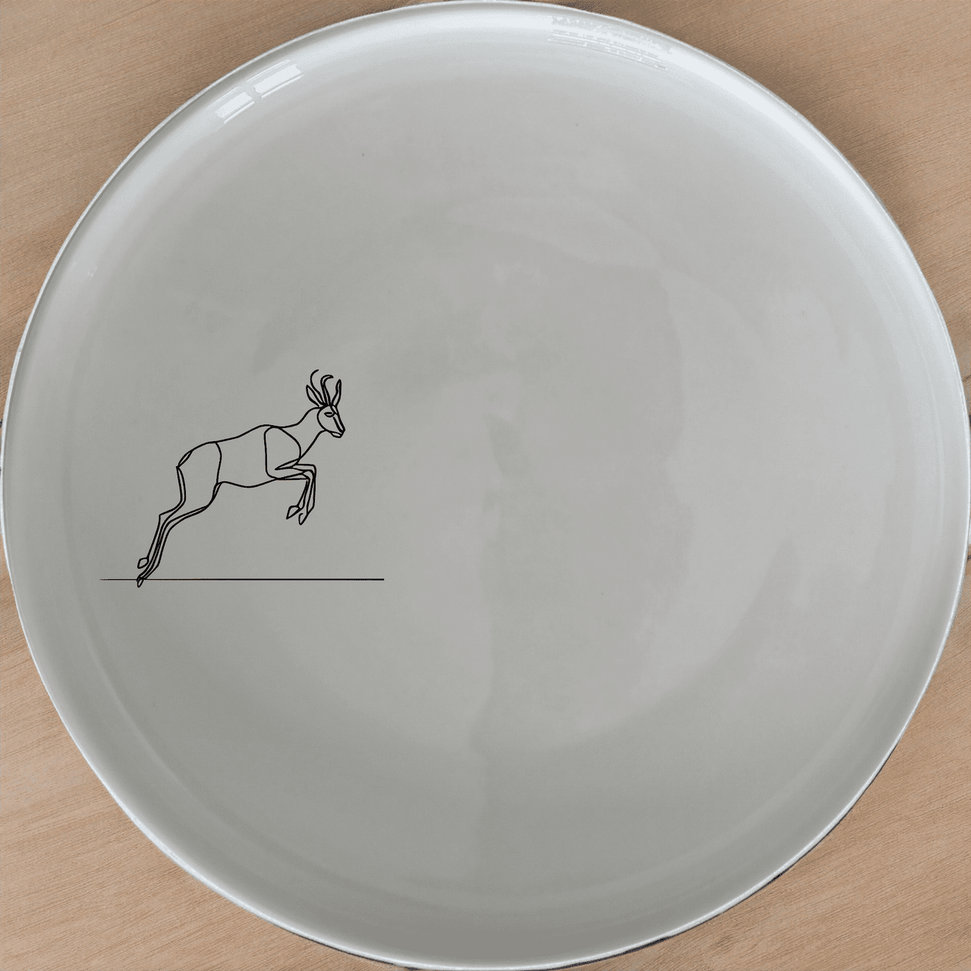 The Springbok Leaping Graceful Silhouette Dinner Plate Set of 4 features a sleek, modern design perfect for any dining table.