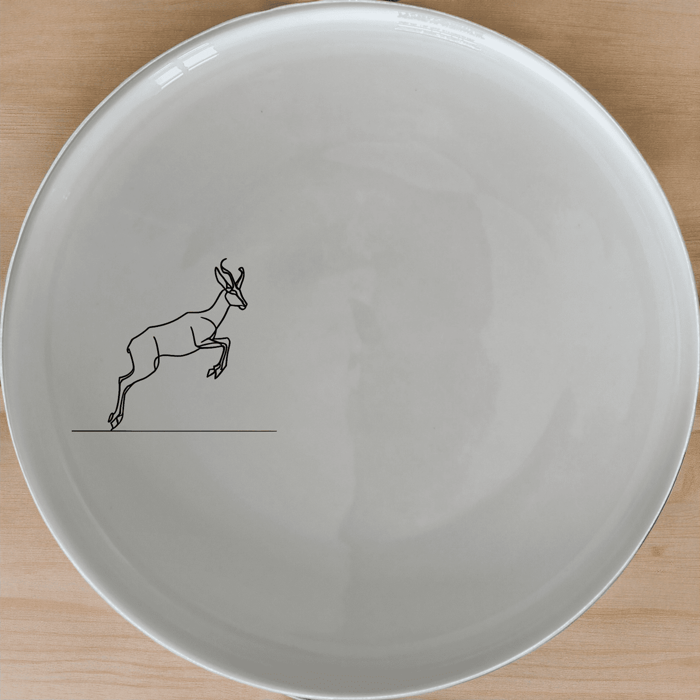 The Springbok Leaping Graceful Silhouette Dinner Plate Set of 4 features a sleek, modern design perfect for any dining table.
