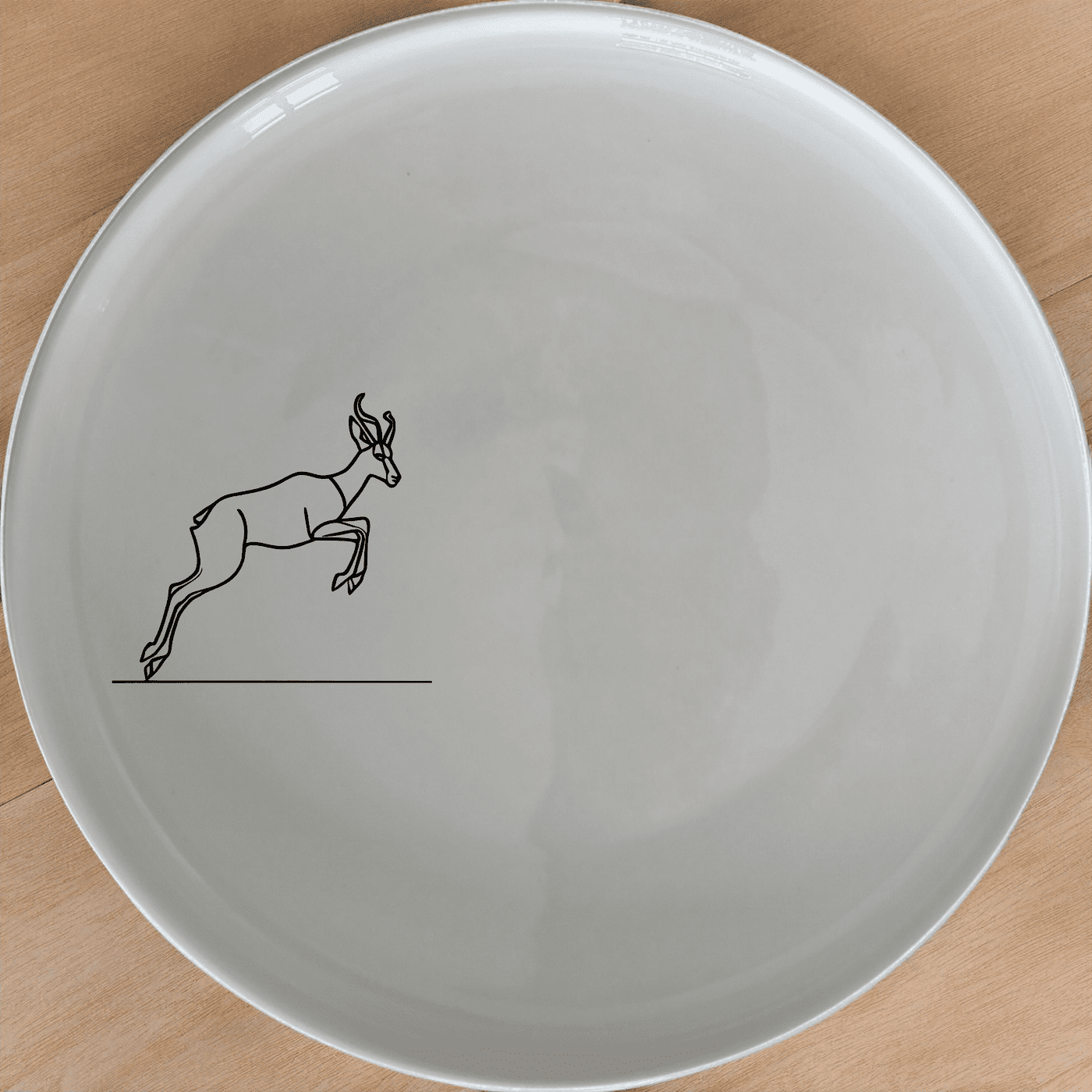 The Springbok Leaping Graceful Silhouette Dinner Plate Set of 4 features a sleek, modern design perfect for any dining table.