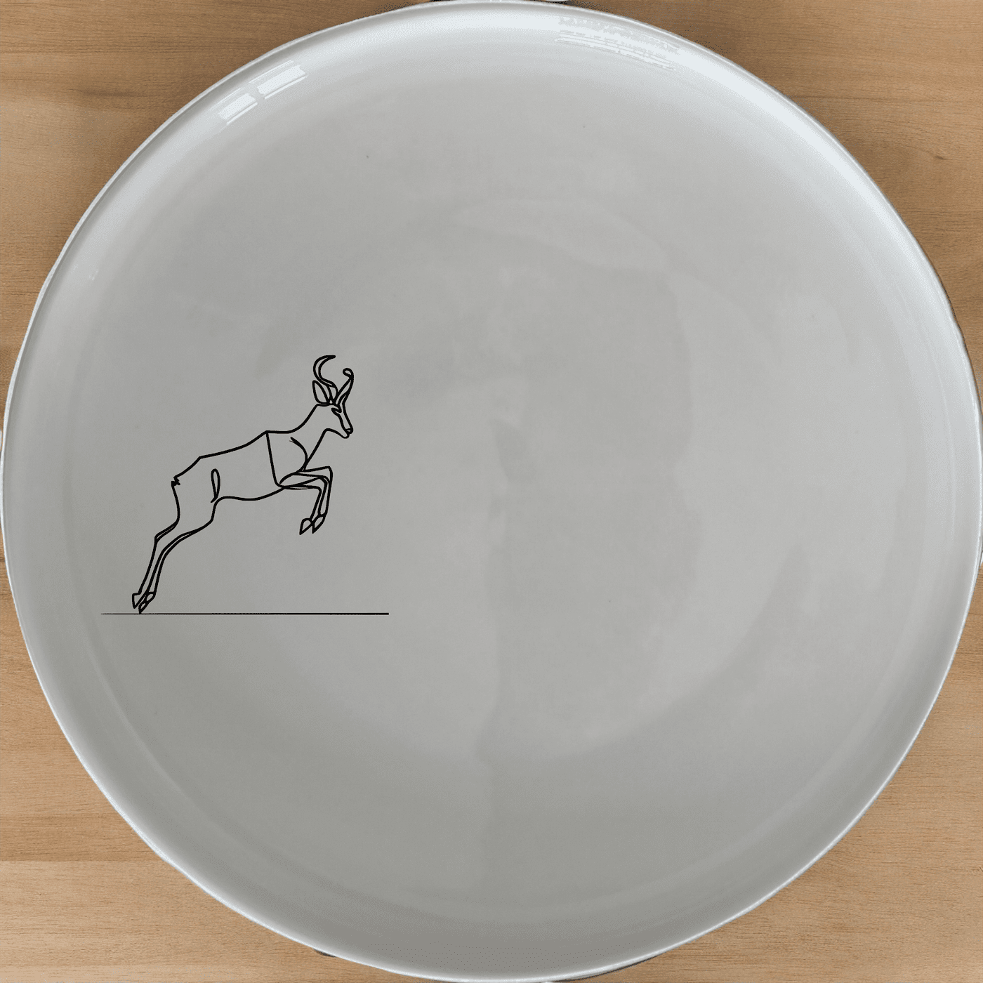 The Springbok Leaping Graceful Silhouette Dinner Plate Set of 4 features a leaping springbok antelope design, perfect for adding a touch of nature to your dining experience.
