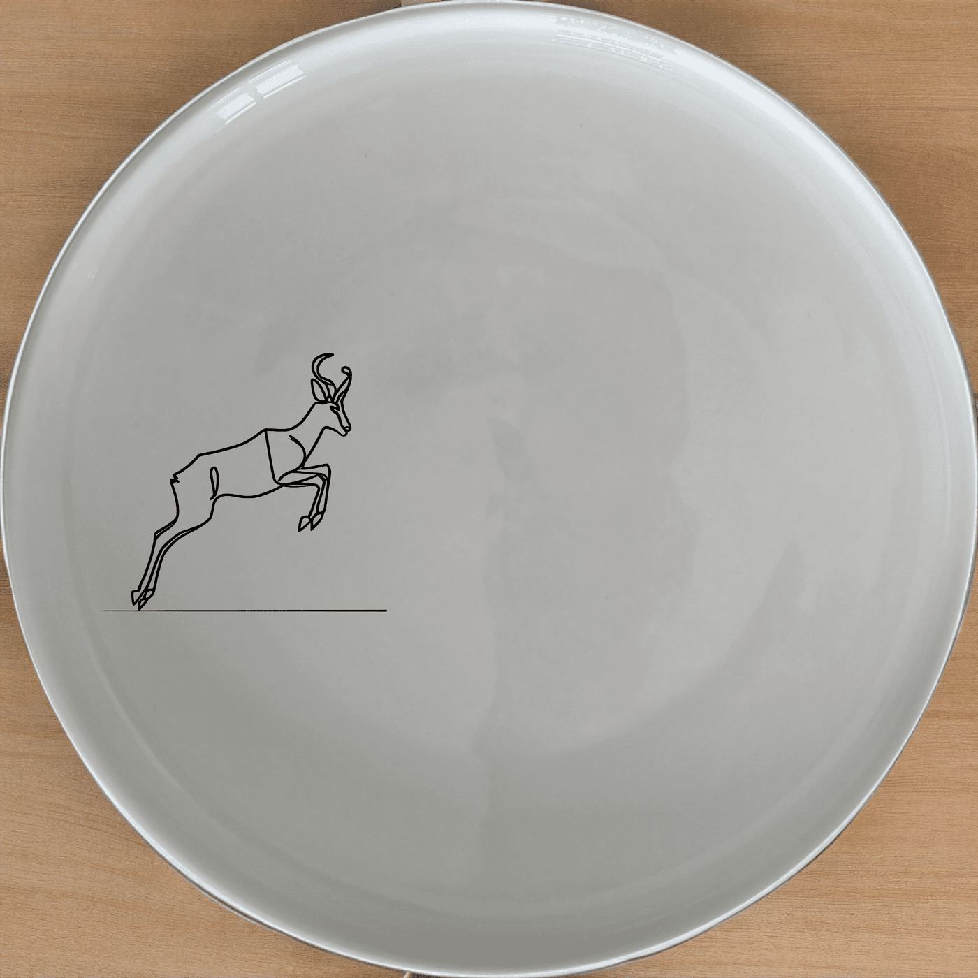 The Springbok Leaping Graceful Silhouette Side Plate Set of 4 features a sleek, modern design perfect for any dining table. Crafted from premium ceramic, these plates are both stylish and functional, ideal for everyday use or special occasions.