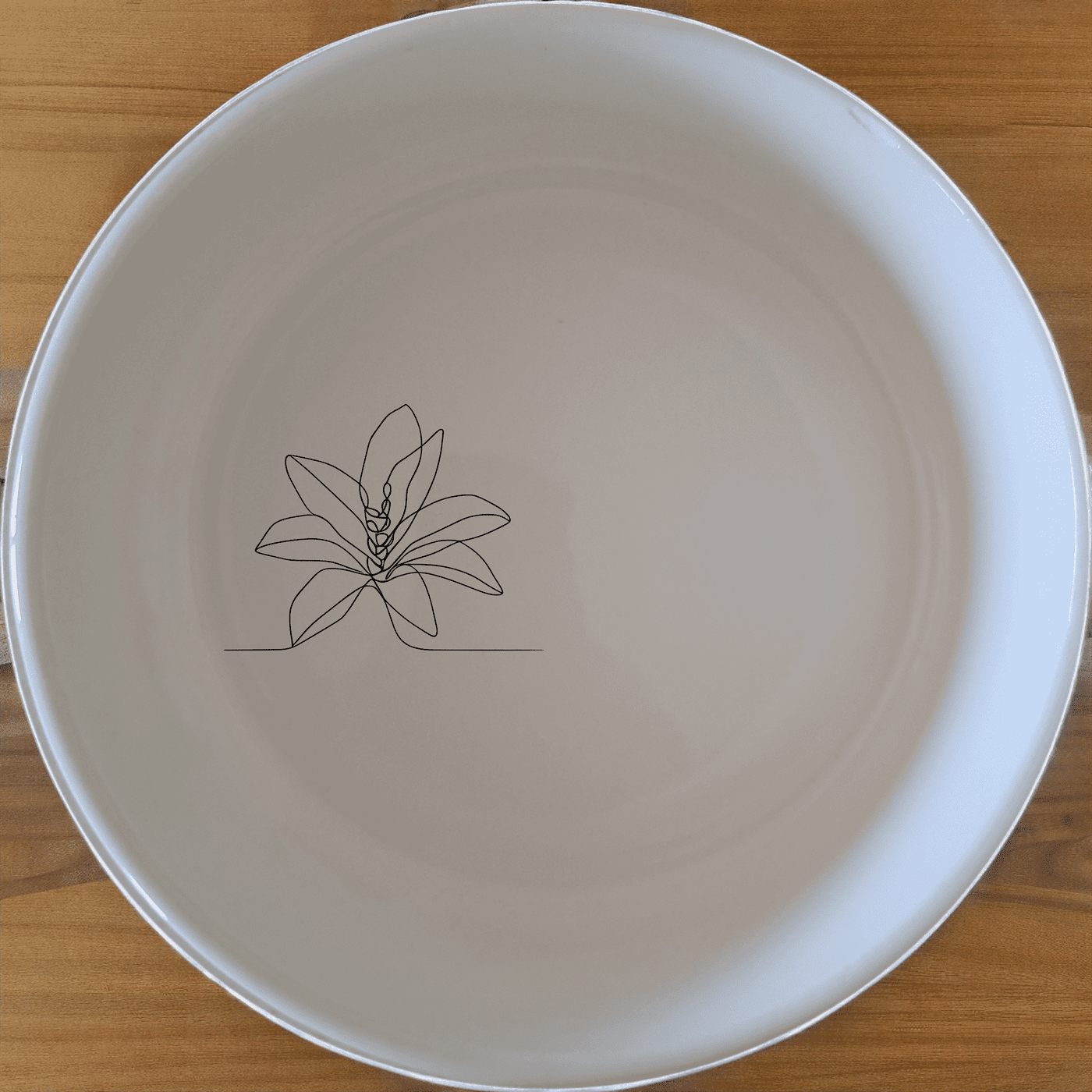 The Stromanthe Triostar Bowl Set of 4 features a minimalist design with a subtle abstract pattern, perfect for modern and contemporary dining settings.