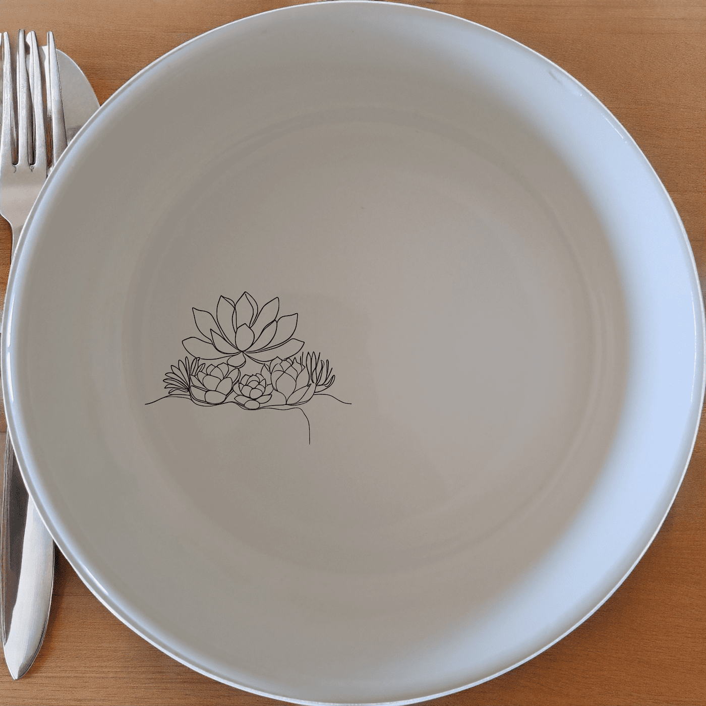 The Succulent Garden Bowl Set of 4 features delicate laser-etched designs perfect for everyday use or special occasions.