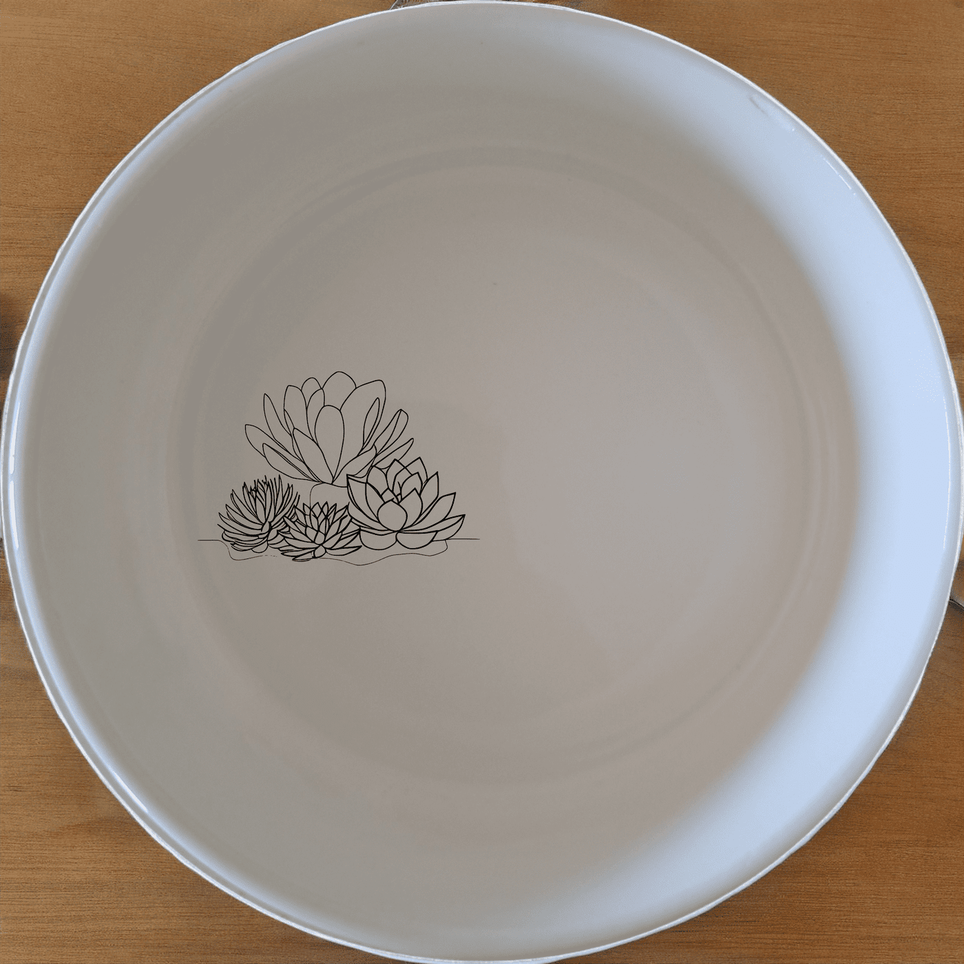 The Succulent Garden Bowl Set of 4 features delicate laser-etched designs that bring nature to your table. Crafted from premium ceramic, these bowls are both microwave and dishwasher safe, making them perfect for everyday use or special occasions.