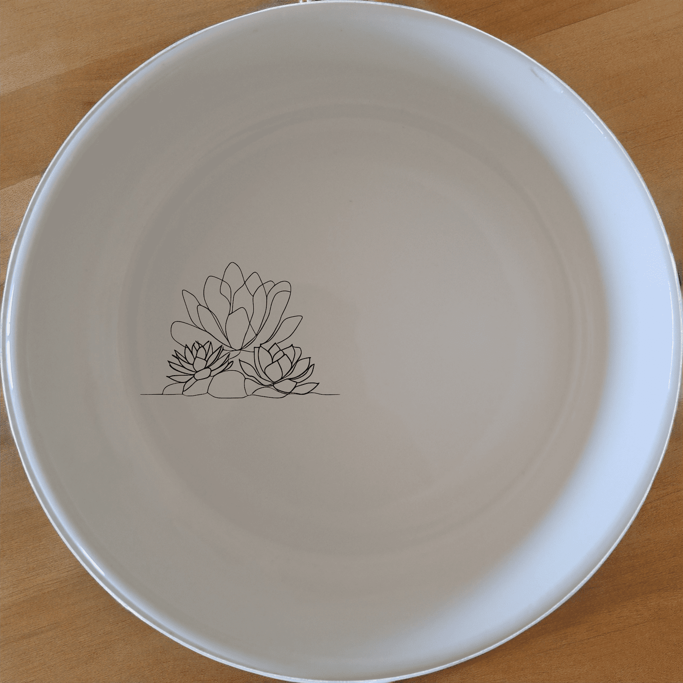 The Succulent Garden Bowl Set of 4 brings a touch of nature to your dining table with its elegant, minimalist design.