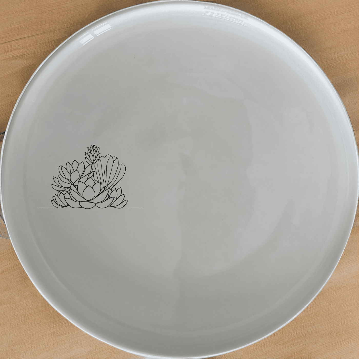 The Succulent Garden Side Plate Set of 4 features a minimalist design with a delicate succulent illustration, perfect for modern dining.