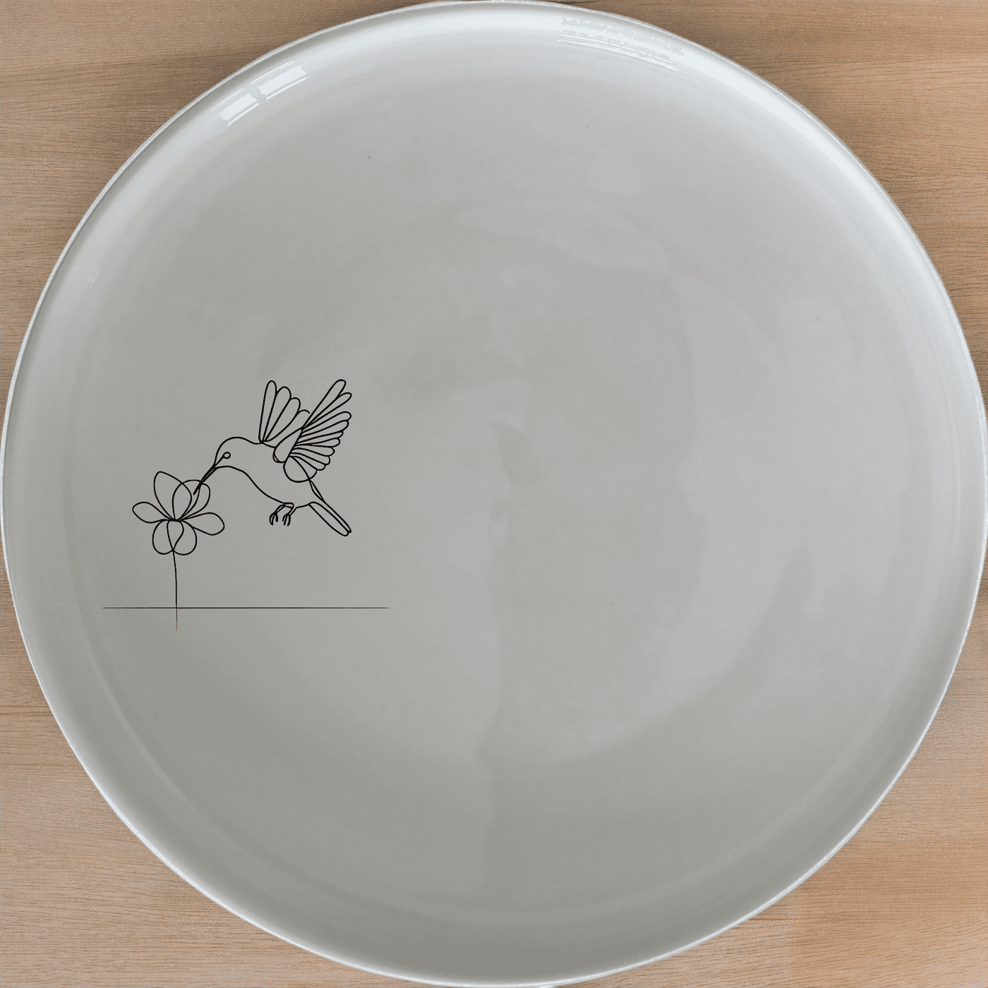 The Sunbird Flower Bloom Dinner Plate Set of 4 features a delicate hummingbird design, perfect for adding a touch of nature to your dining table.
