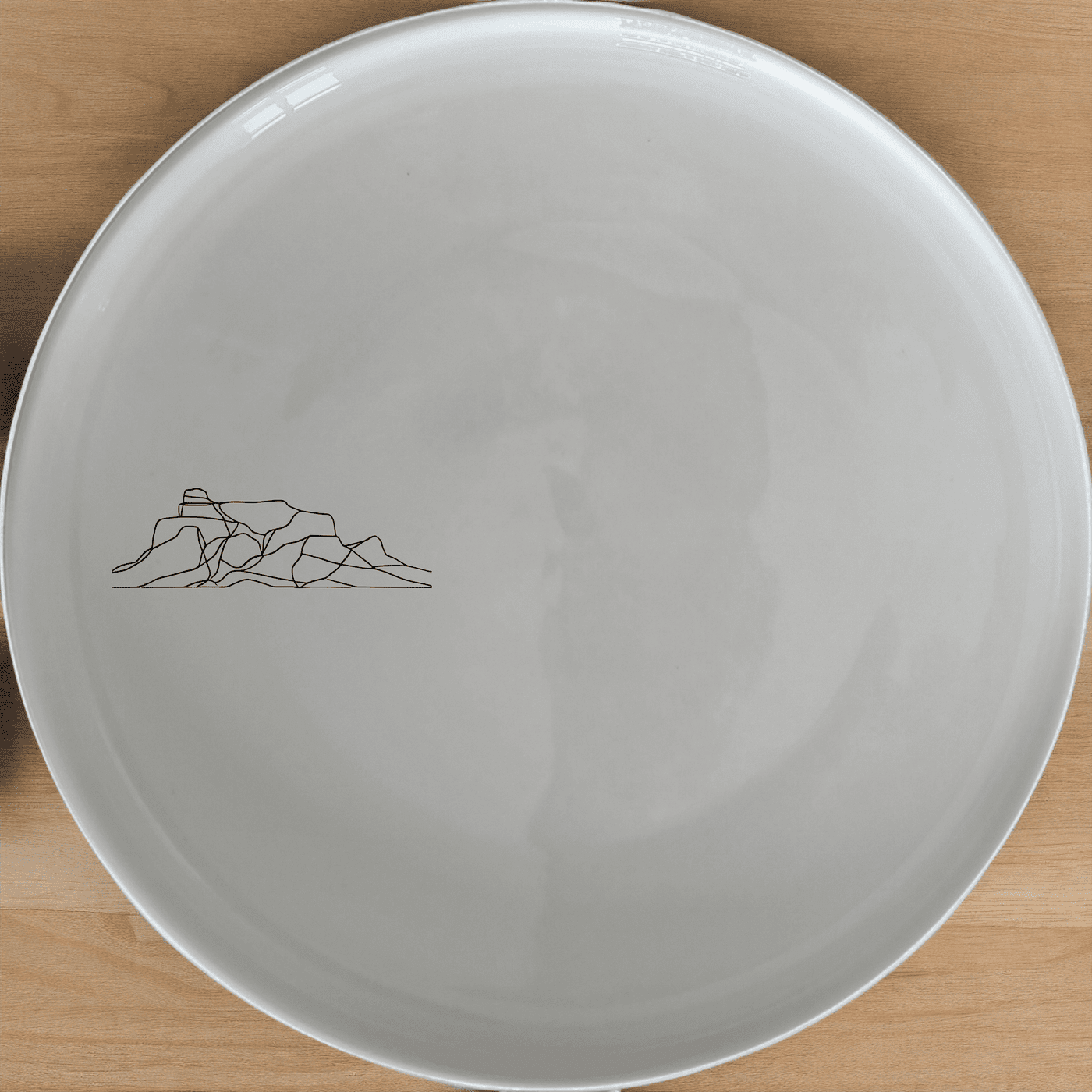 Table Mountain Dinner Plate Set of 4 features a minimalist design perfect for modern dining. Crafted from durable ceramic, these plates are microwave and dishwasher safe.