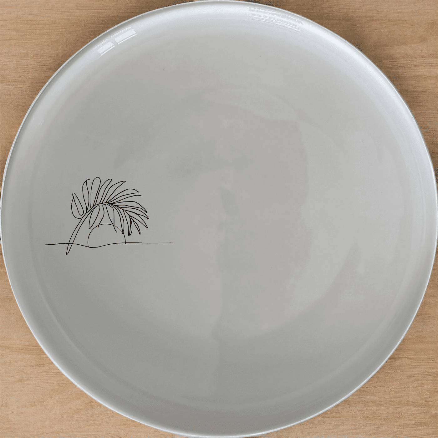 The Tropical Palm Sunset Side Plate Set of 4 brings a serene beach vibe to your dining table with minimalist palm frond designs.