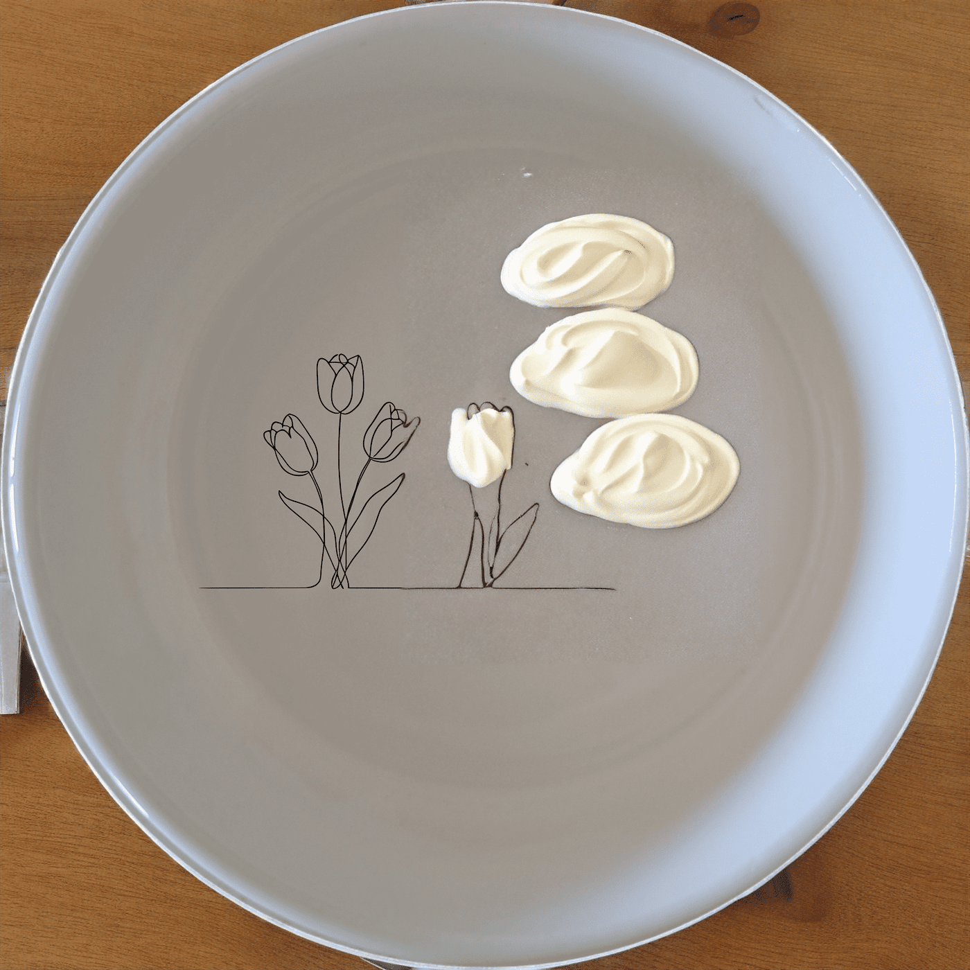 The Tulips Bowl Set of 4 features a minimalist design with elegant tulip illustrations, perfect for everyday use or special occasions.