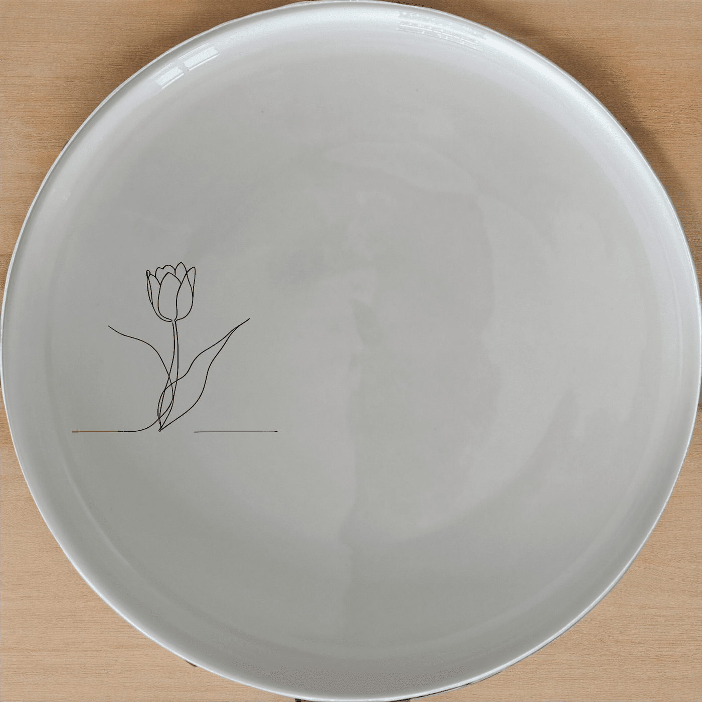 The Tulips Dinner Plate Set of 4 features a minimalist design with a single tulip illustration, perfect for modern dining.