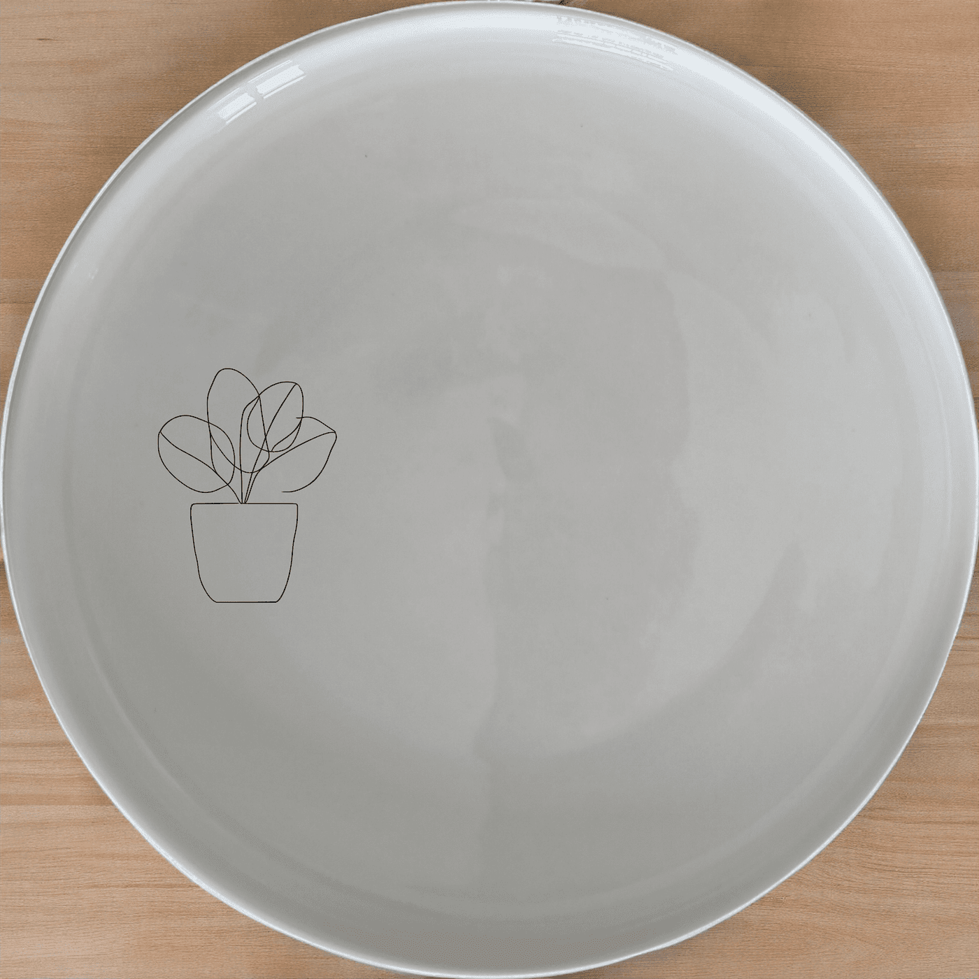 The Warm Terracotta Pots Leafy Plants Dinner Plate Set of 4 brings a touch of nature to your dining table with its minimalist design and earthy tones.