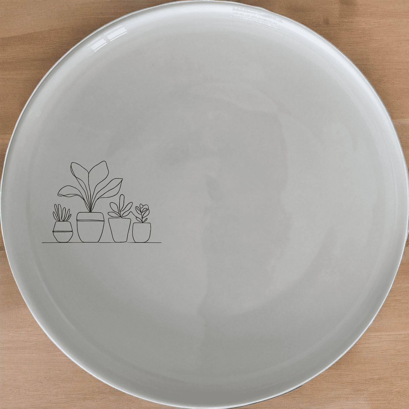 The Warm Terracotta Pots Leafy Plants Side Plate Set of 4 features minimalist plant illustrations, perfect for modern dining and everyday use.