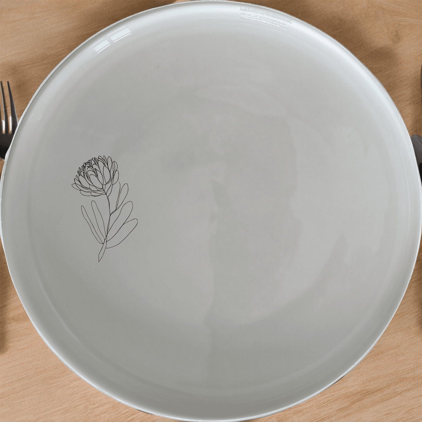 Discover the Western Cape Fynbos Side Plate Set of 4, a stunning collection of ceramic plates adorned with delicate botanical designs.