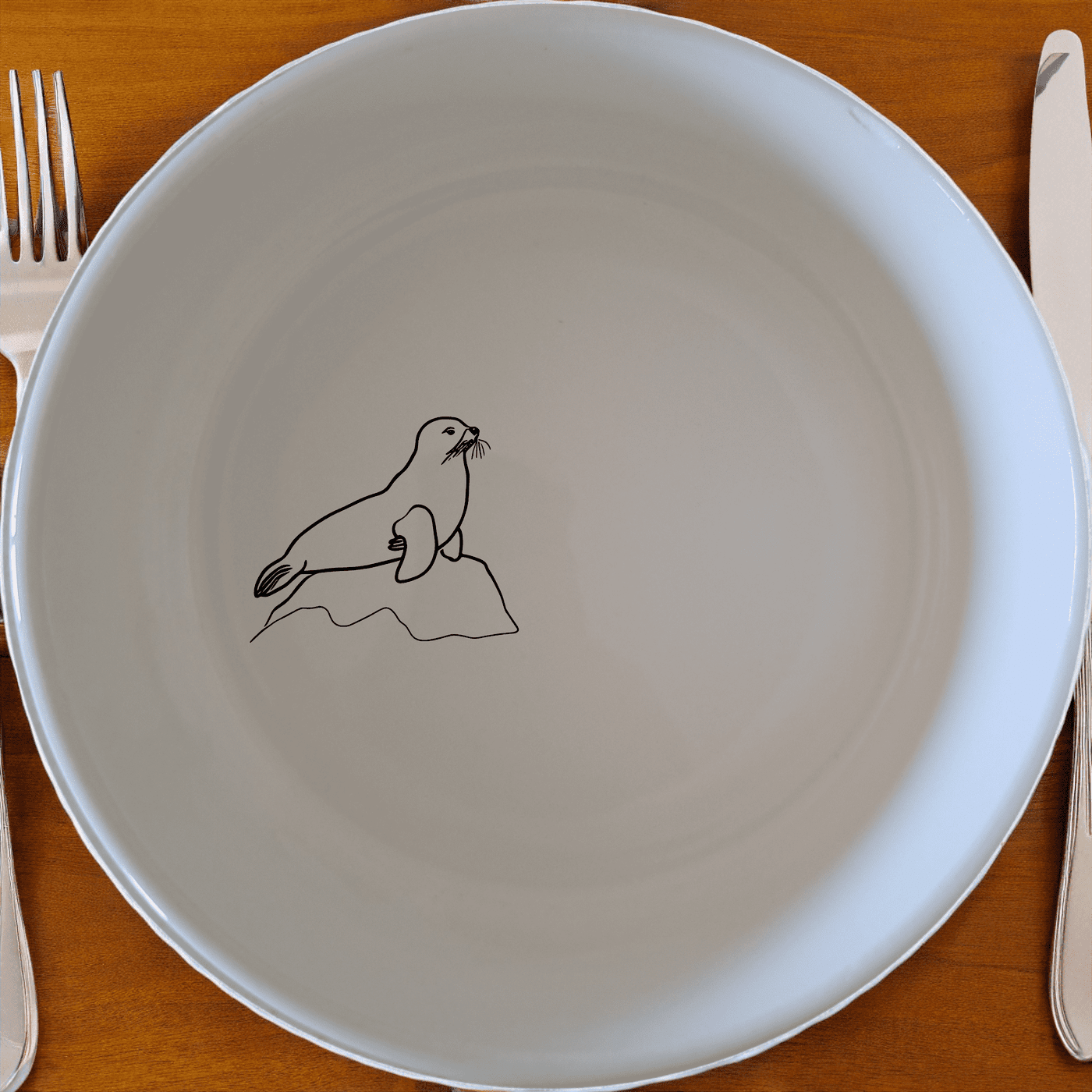 The Abstract Harbor Seal Bowl Set of 4 - Range 2 features minimalist harbor seal designs on white ceramic bowls, perfect for modern dining.