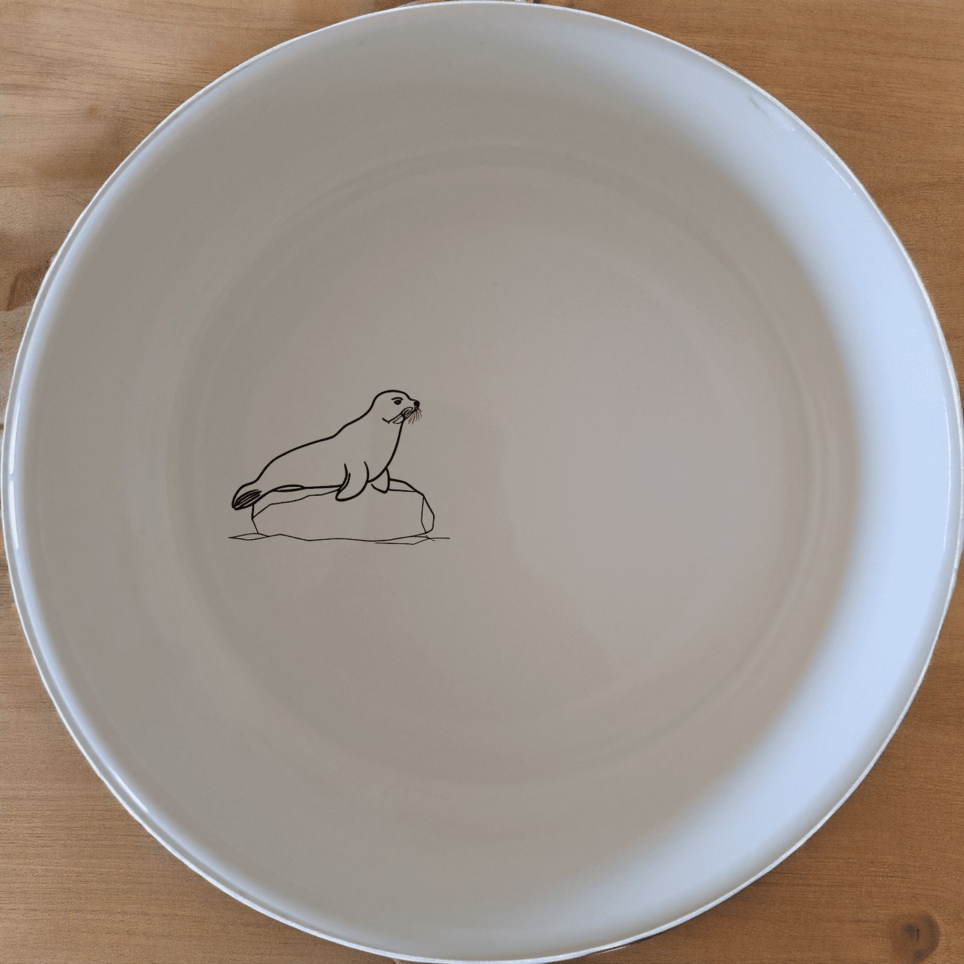 The Harbor Seal Bowl Set of 4 - Range 3 features a charming harbor seal design on each bowl, perfect for adding a touch of nature to your dining experience.