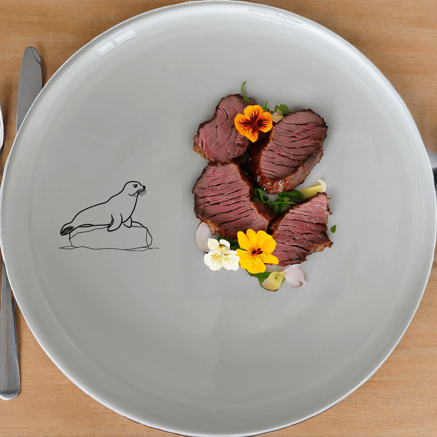 The Harbor Seal Dinner Plate Set of 4 - Range 3 features a charming harbor seal design, perfect for adding a touch of nature to your dining table.