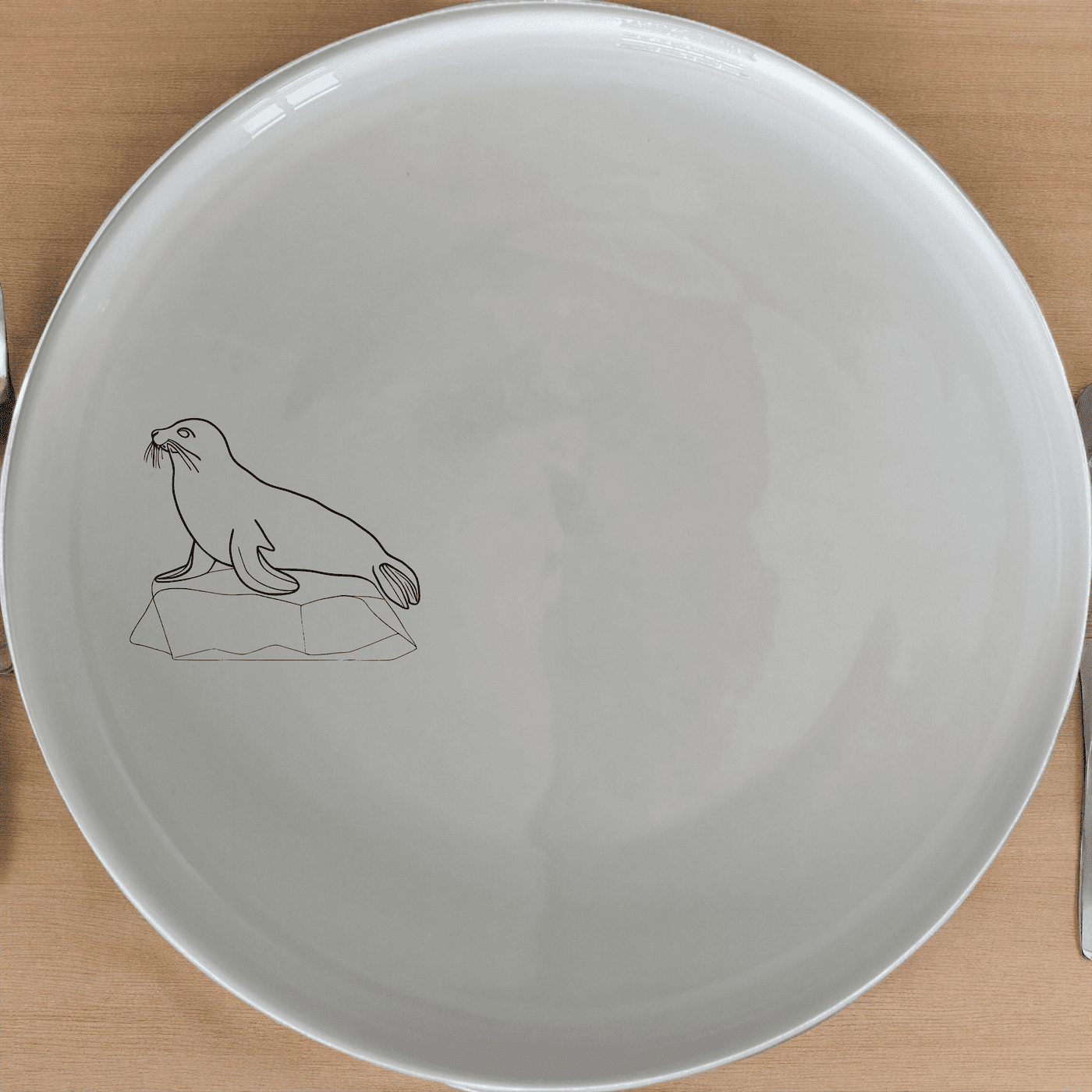 Harbor Seal Rock Dinner Plate Set of 4 - Range 4 is a stylish and modern dinner plate set featuring an abstract harbor seal design.