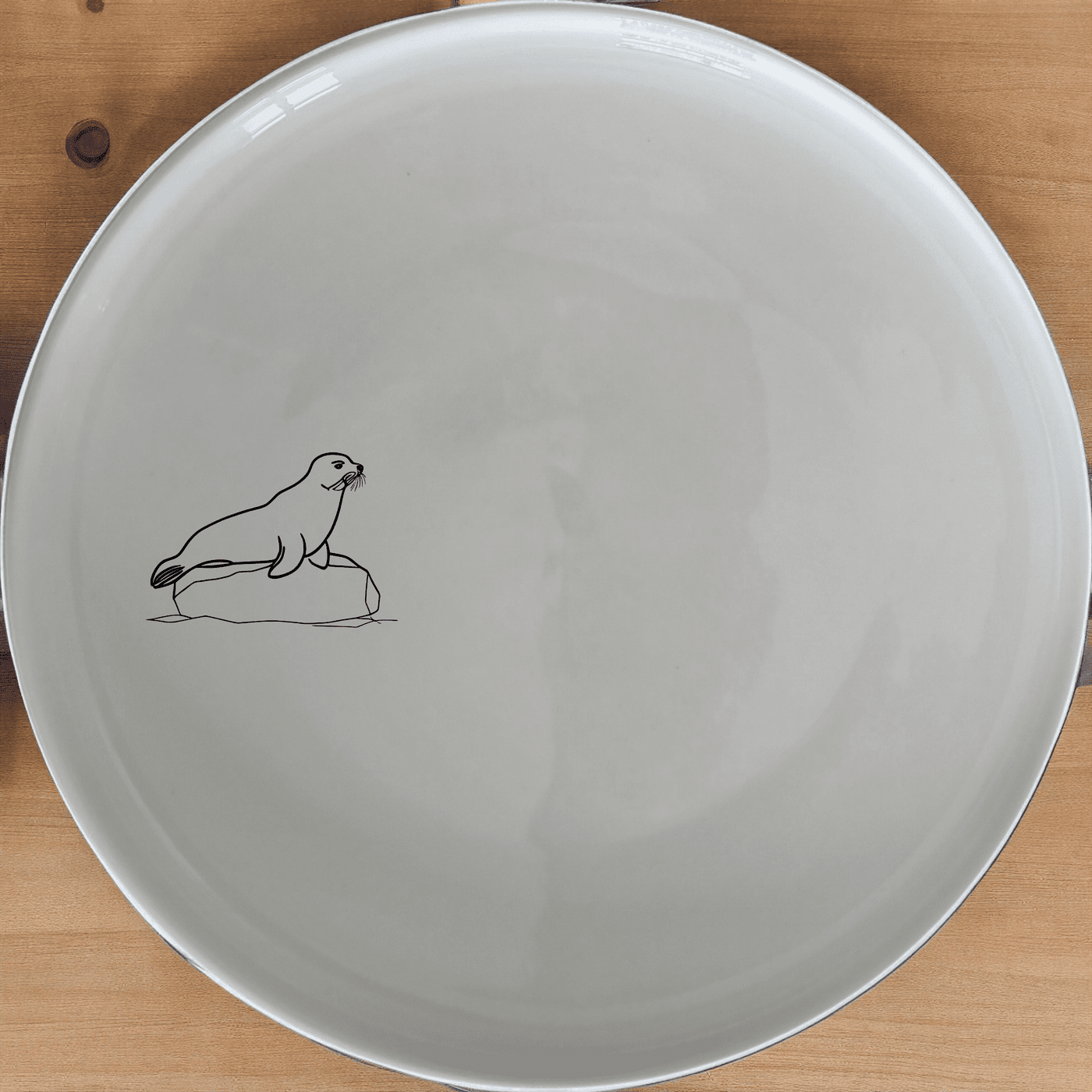 Harbor Seal Rock Side Plate Set of 4 - Range 3 is a beautiful and unique set of plates featuring an abstract harbor seal design. Perfect for any kitchen or dining room.