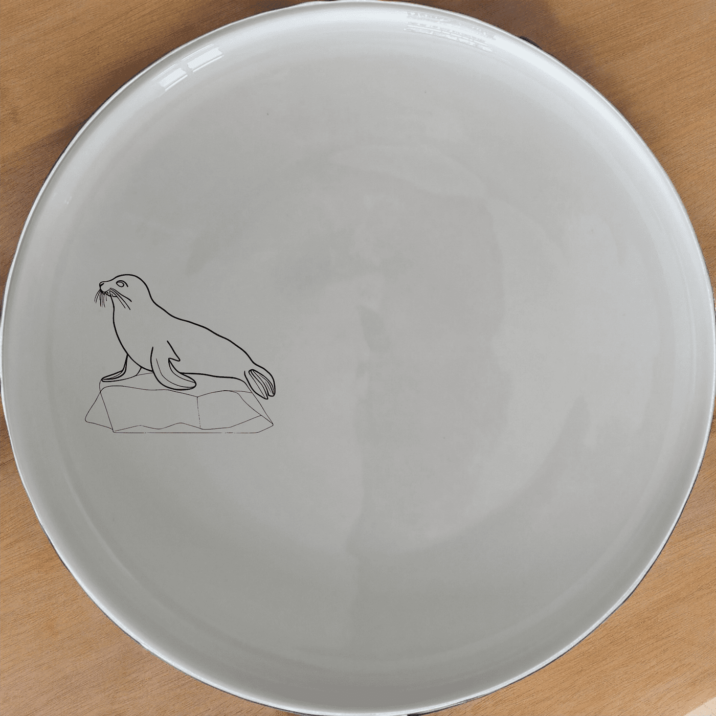 The Abstract Harbor Seal Side Plate Set of 4 - Range 4 features a minimalist design perfect for modern dining spaces.