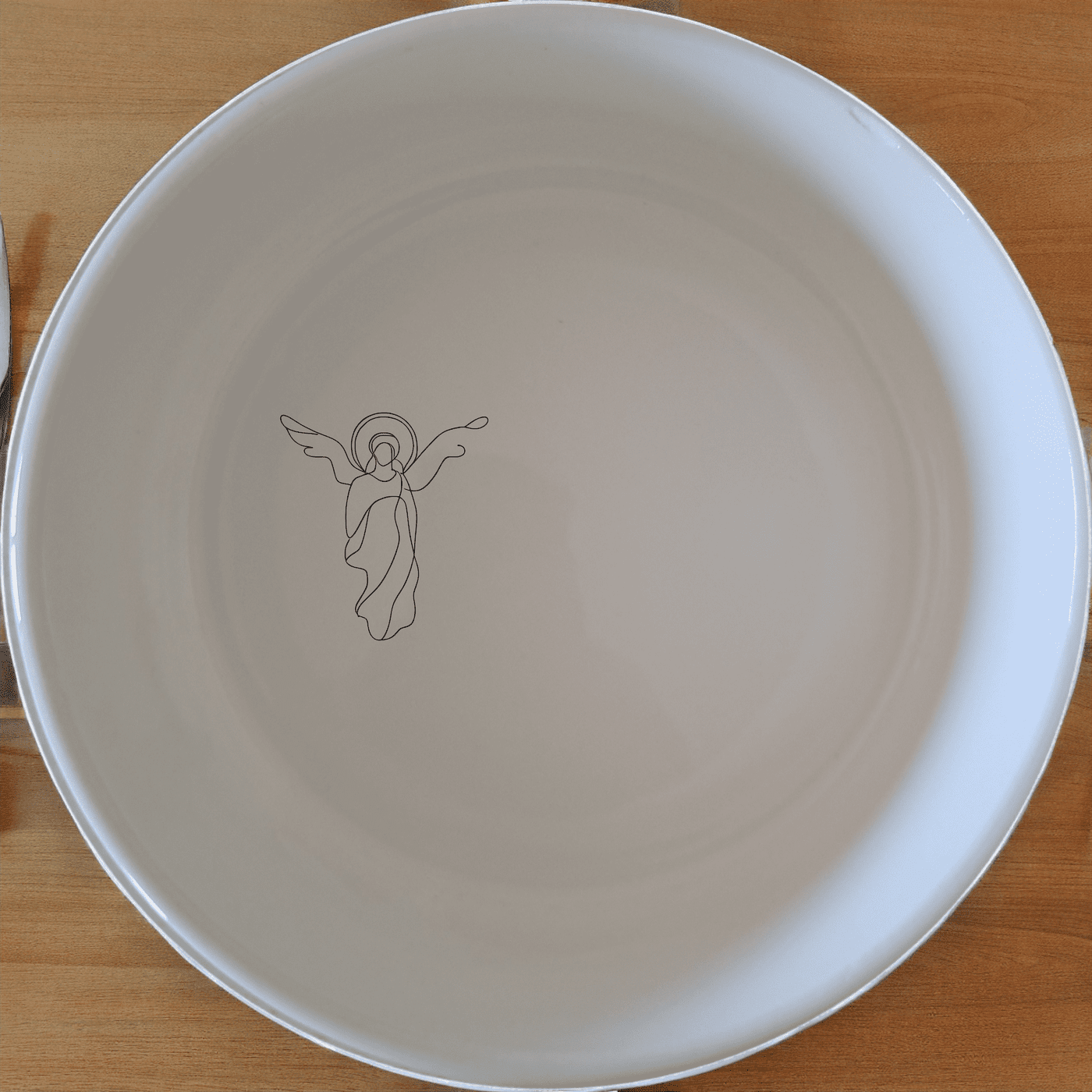 Discover the Christian Imagery Bowl Set of 4, a beautifully designed set of four white ceramic bowls featuring subtle religious artwork.