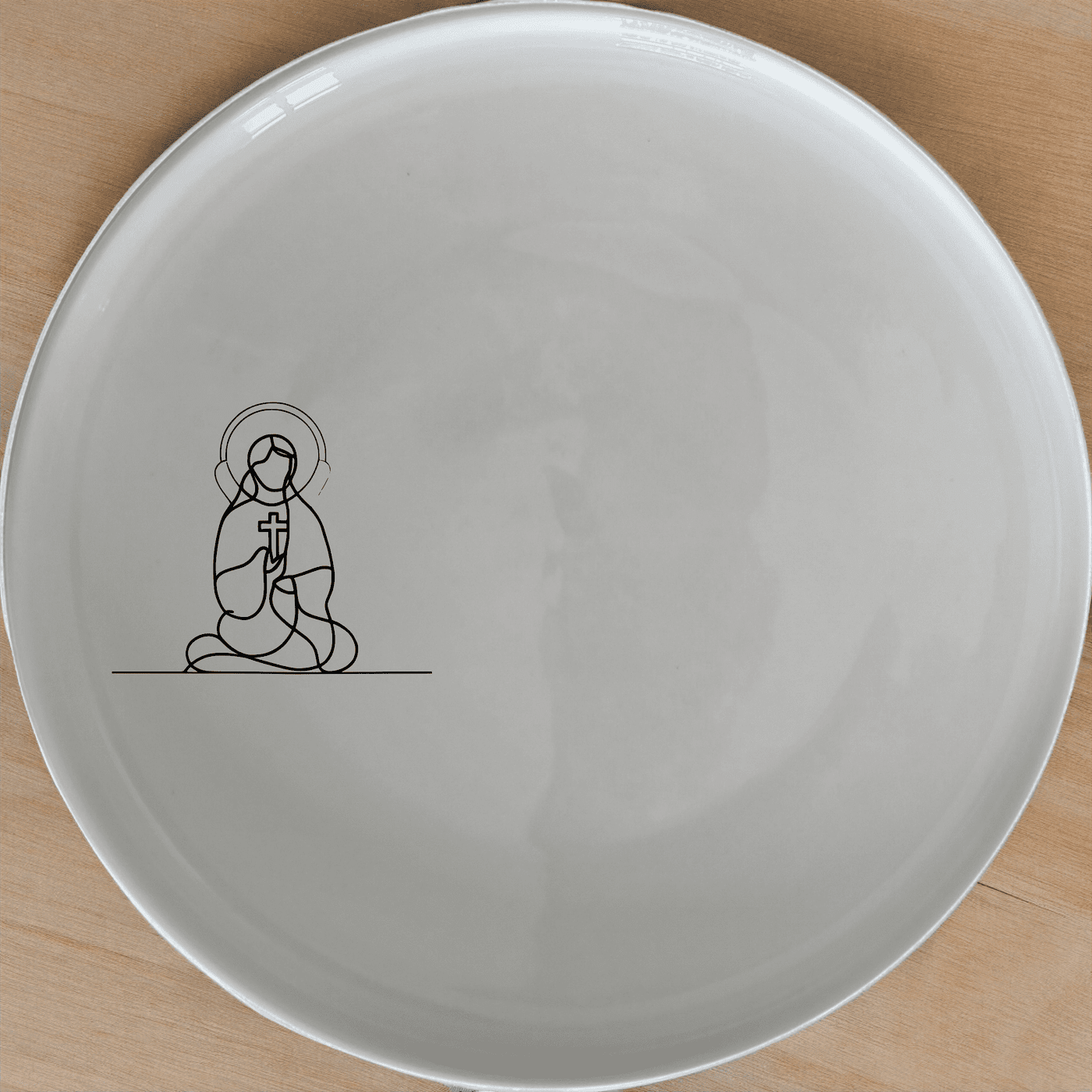 The Christian Imagery Dinner Plate Set of 4 features a serene and contemplative design, perfect for adding a touch of spirituality to your dining experience.